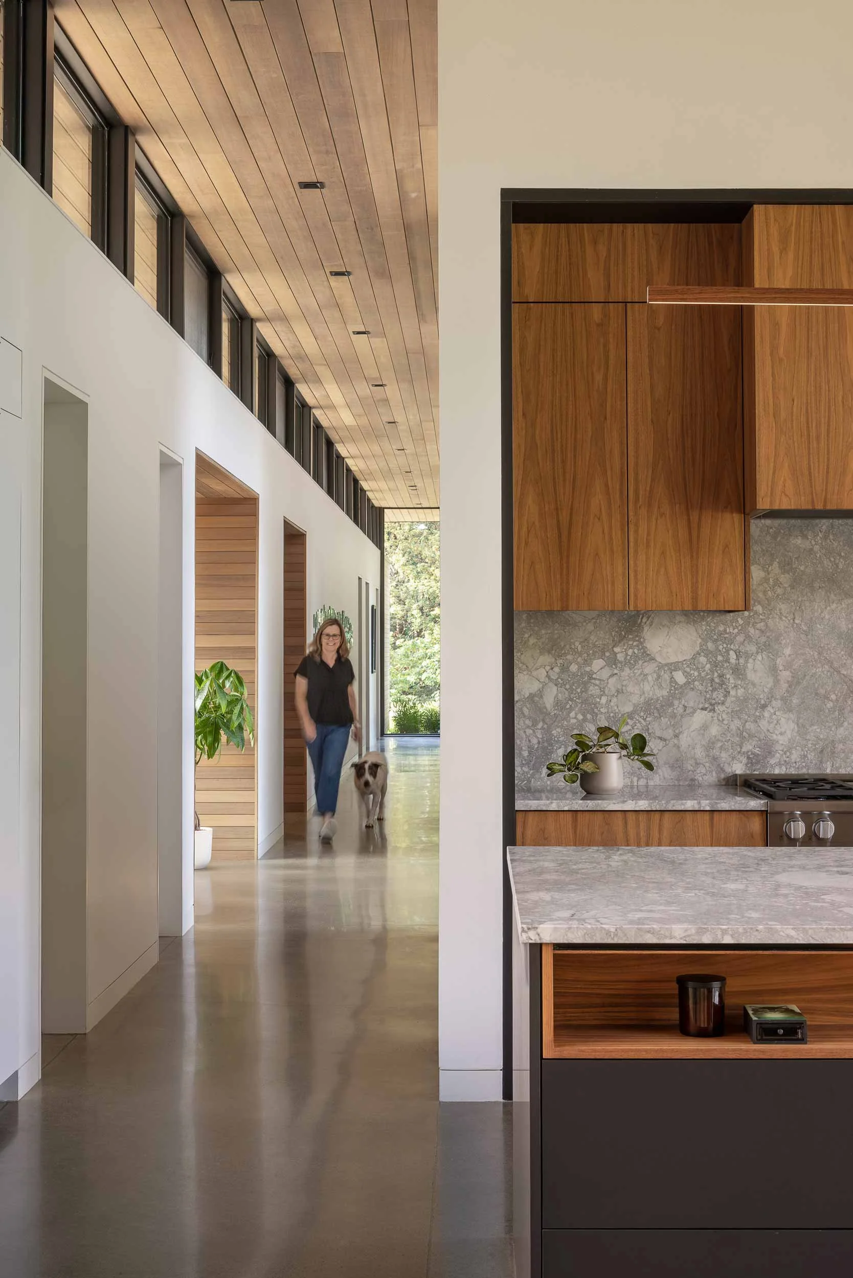 View down hallway with concrete floors