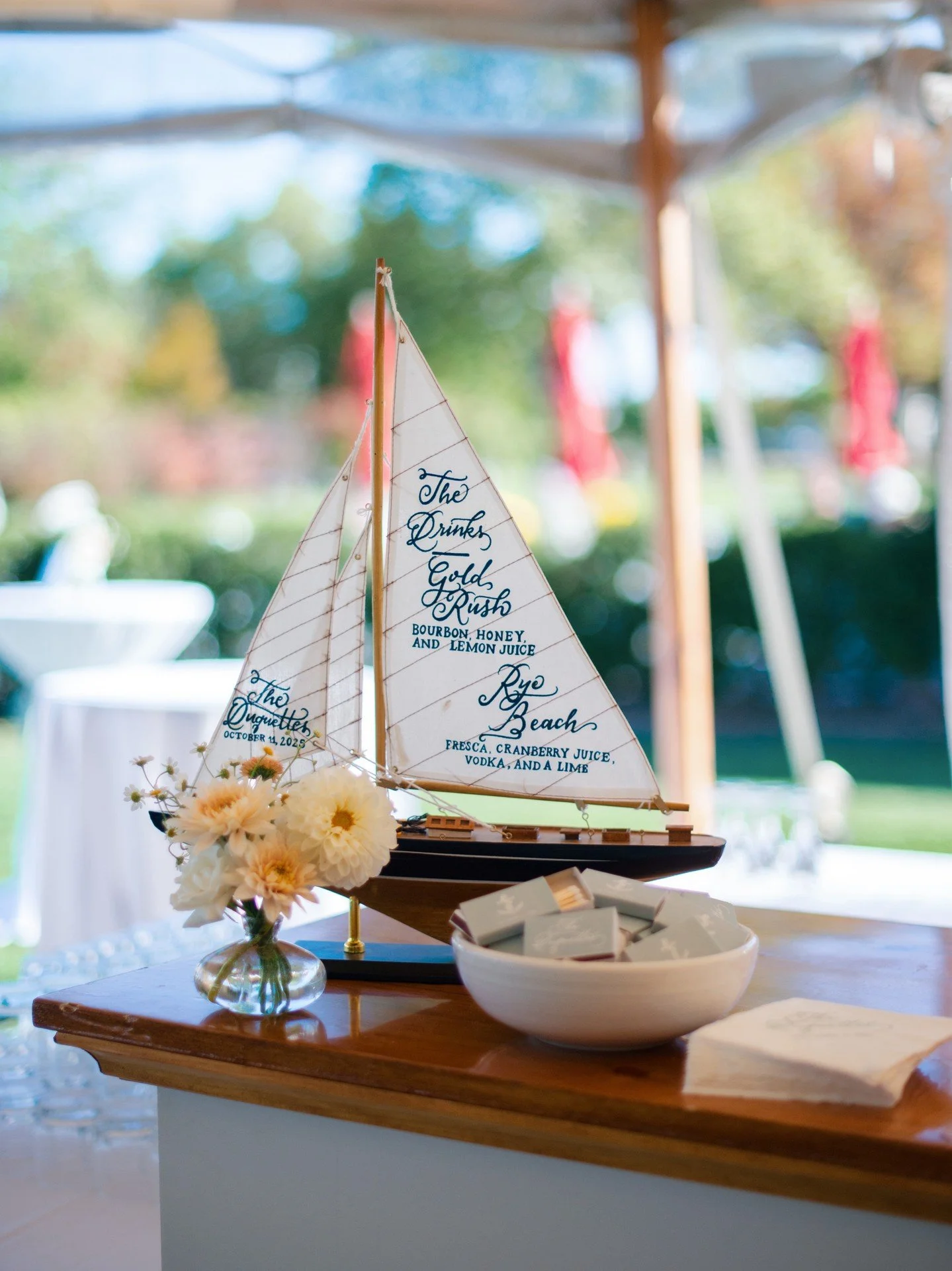 a much-needed timeline refresher from the summer house drama a la this sailboat bar menu and custom matchbooks for the duquettes&rsquo; coastal wedding