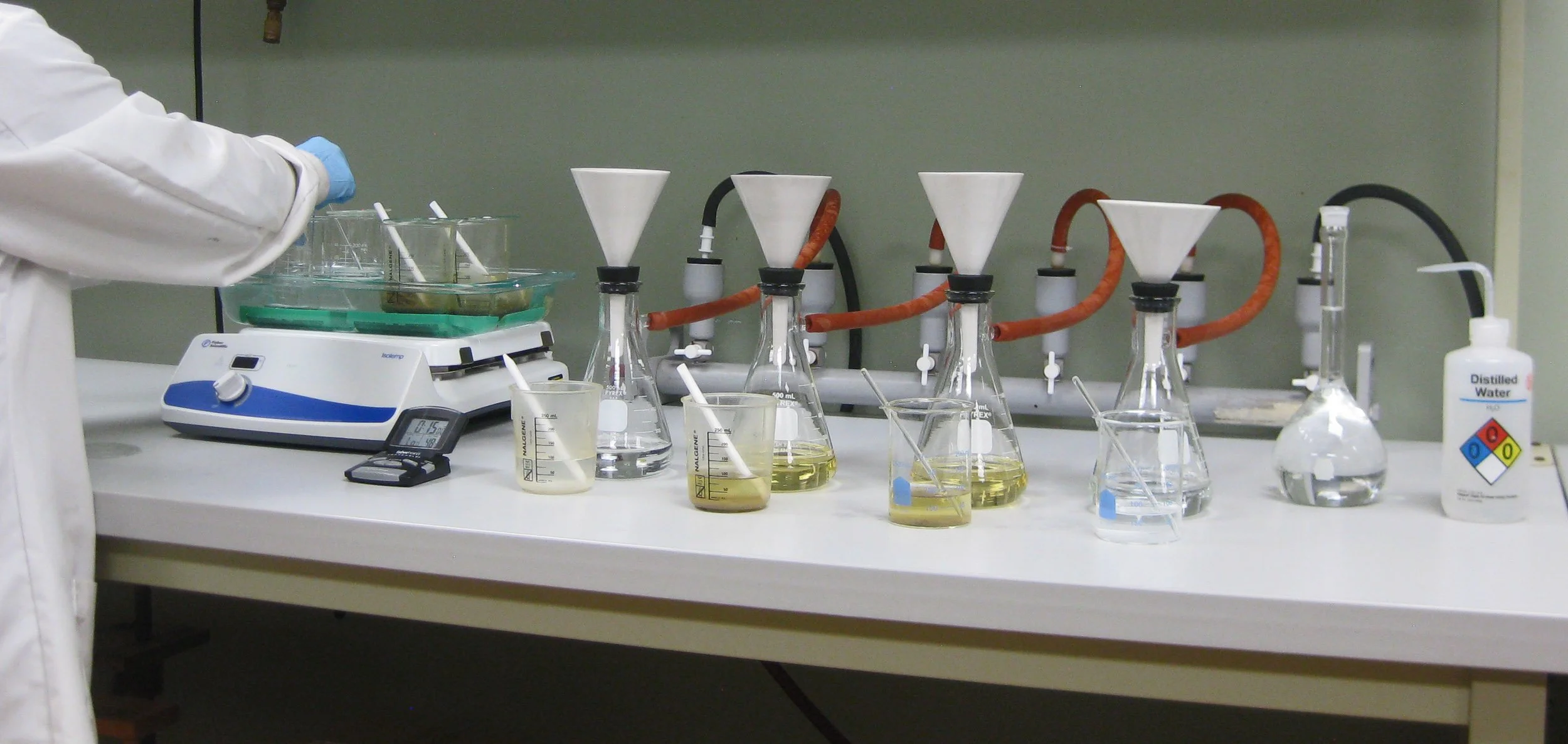 Chemist digesting historic mortar samples for compositional analysis using ASTM C1324