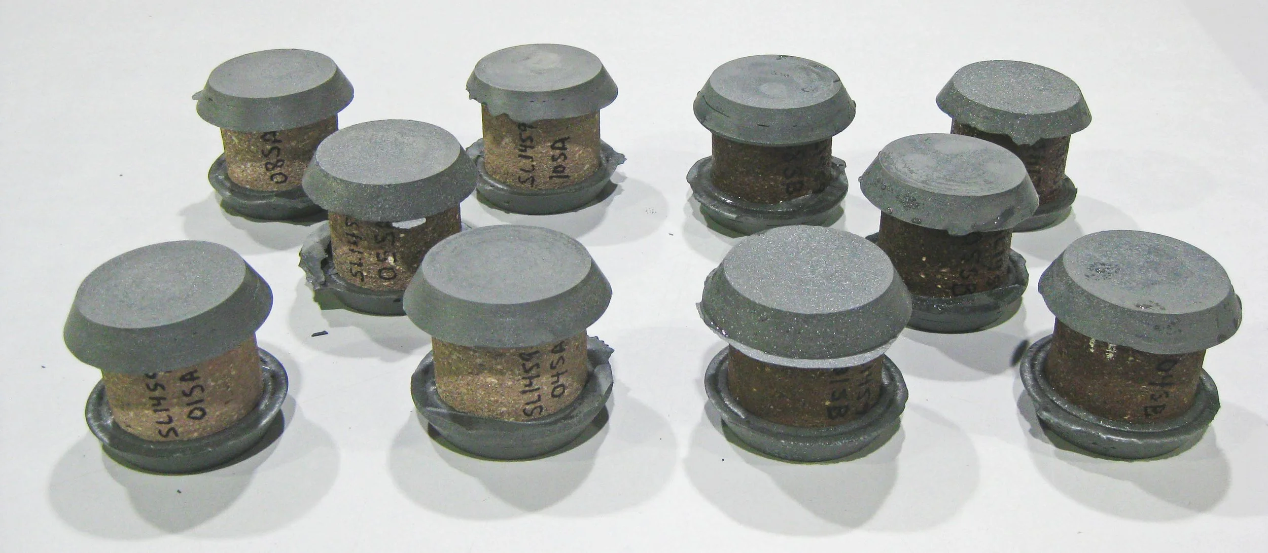Cast stone cores capped in preparation for compressive strength testing ASTM C1194