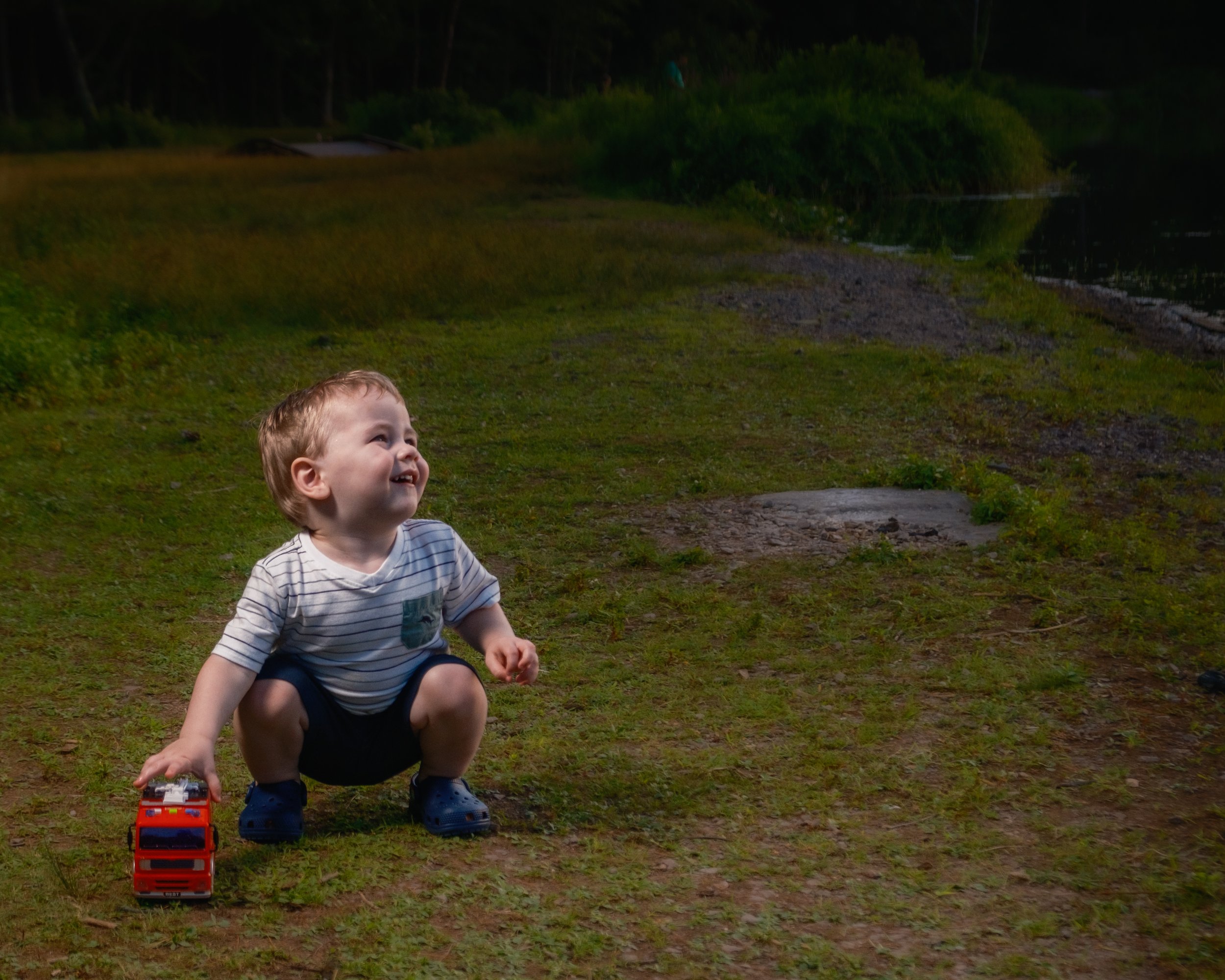 Thomas plays with his firetruck during family photo sessions with Paulette Michelle Photography