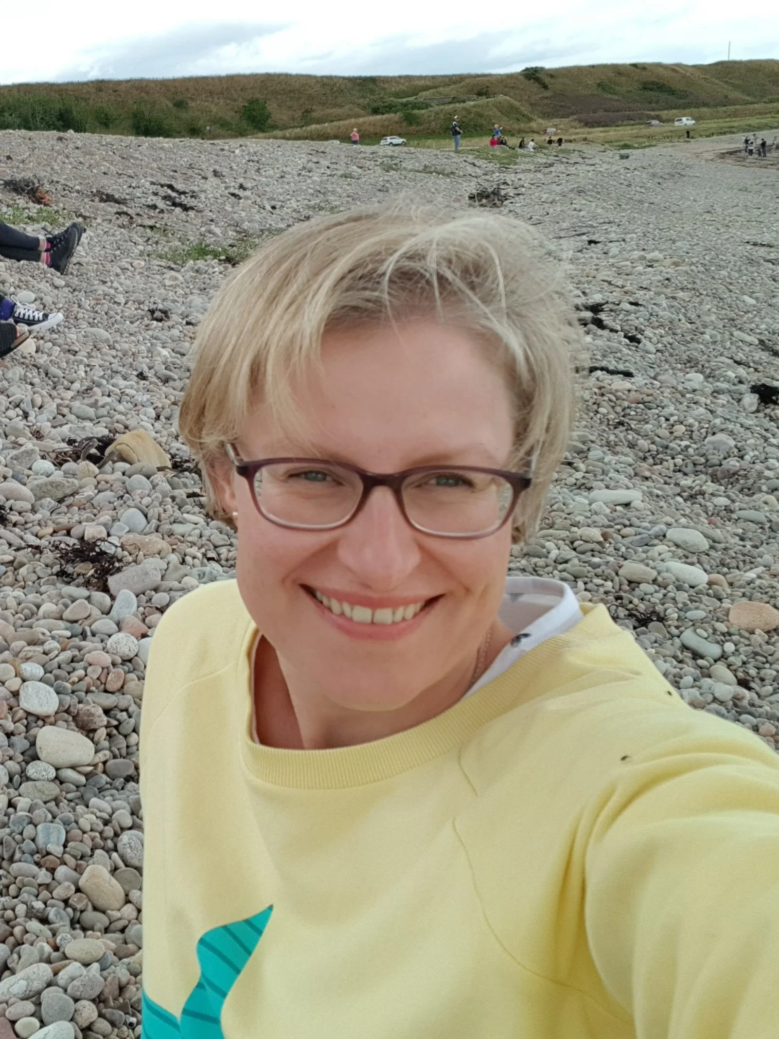 headshot of Izzie, happy client of web design by Ella