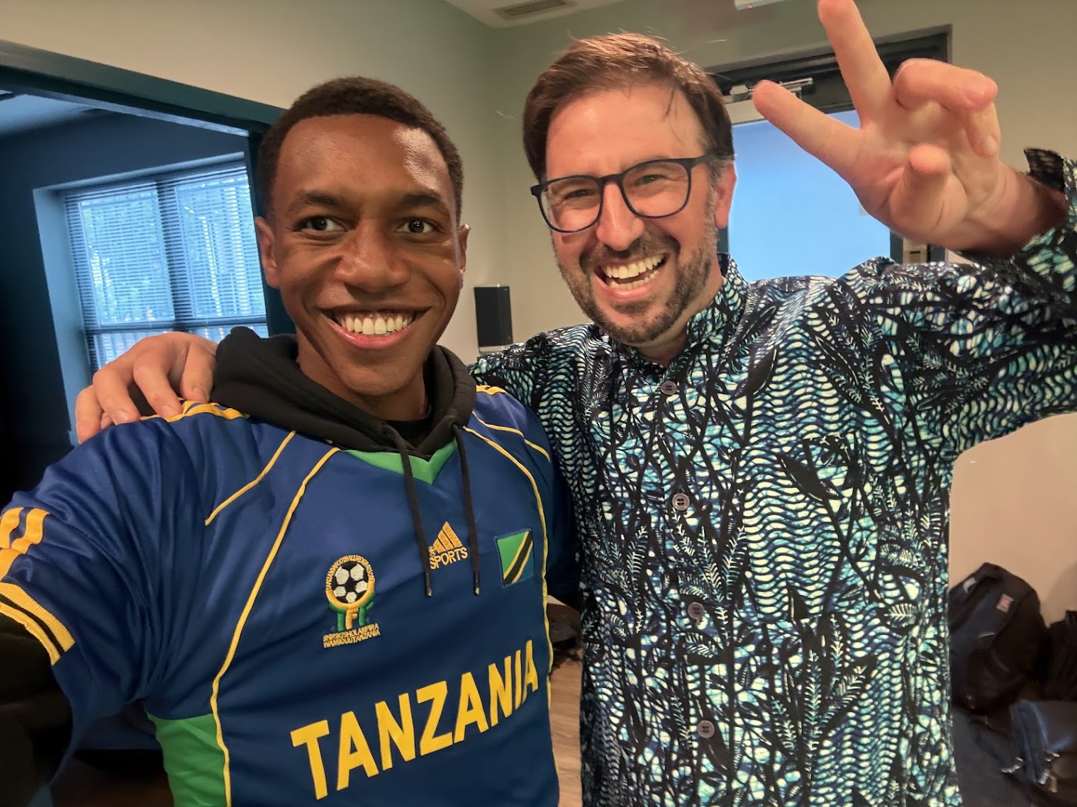 Program Director, Dr. Micah Hughes, pictured with Lance celebrating East African culture
