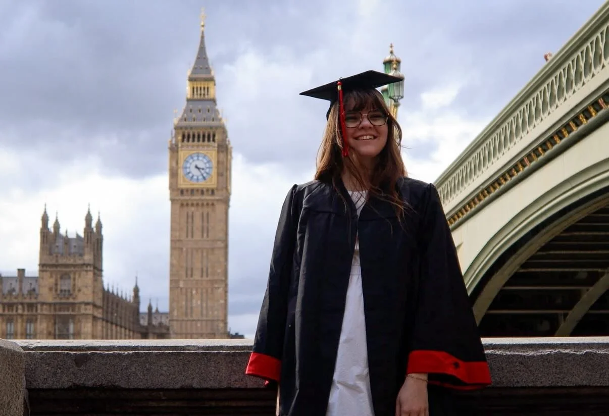 Study abroad student in London England in graduation cap and gown
