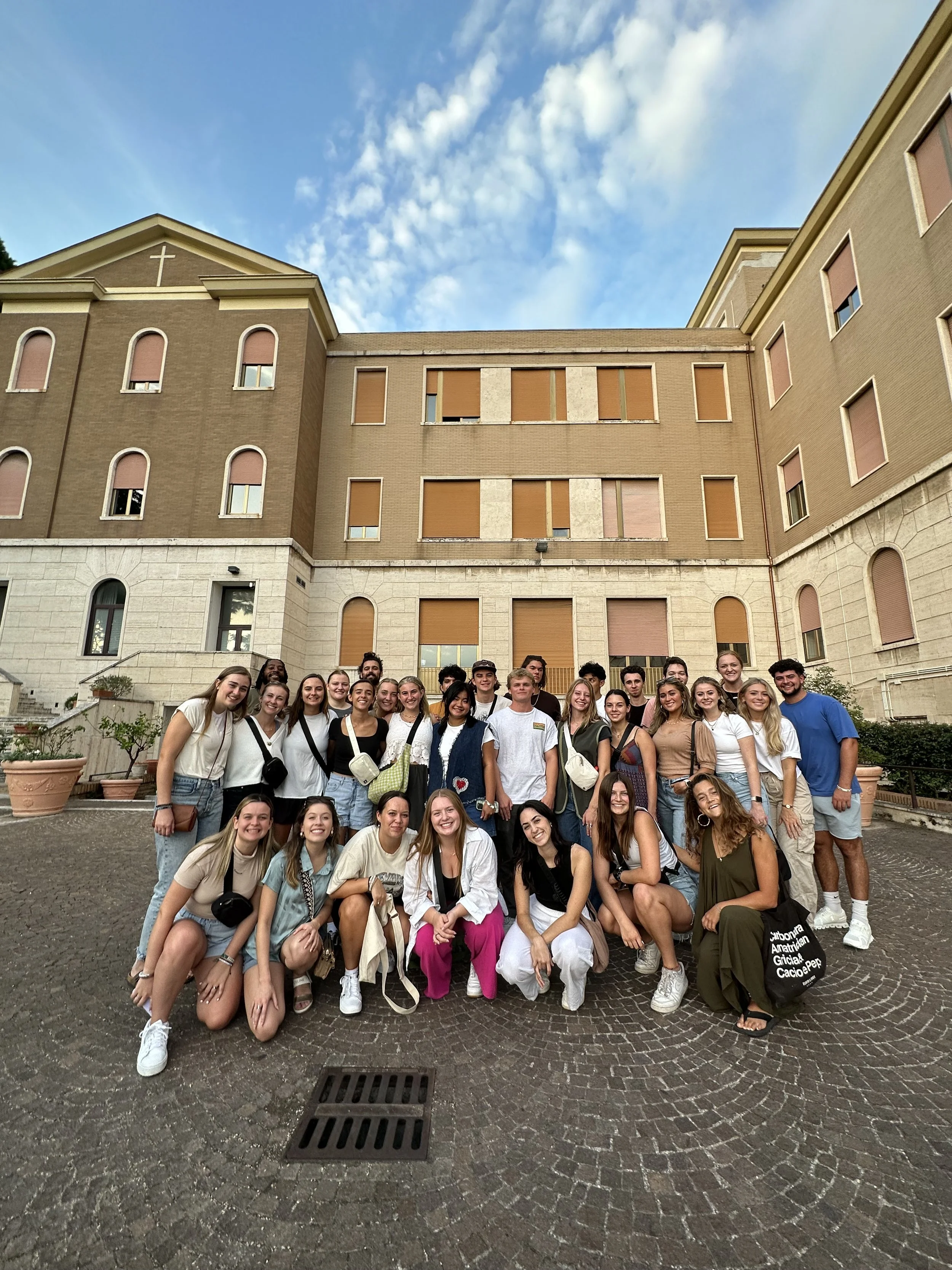 A group photo of North American students outside of their study abroad study center in Rome Italy.