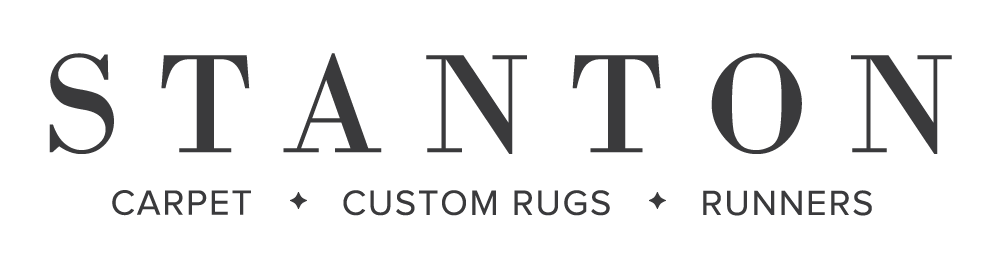 Logo for Stanton featuring the words 'Carpet,' 'Custom Rugs,' and 'Runners'.