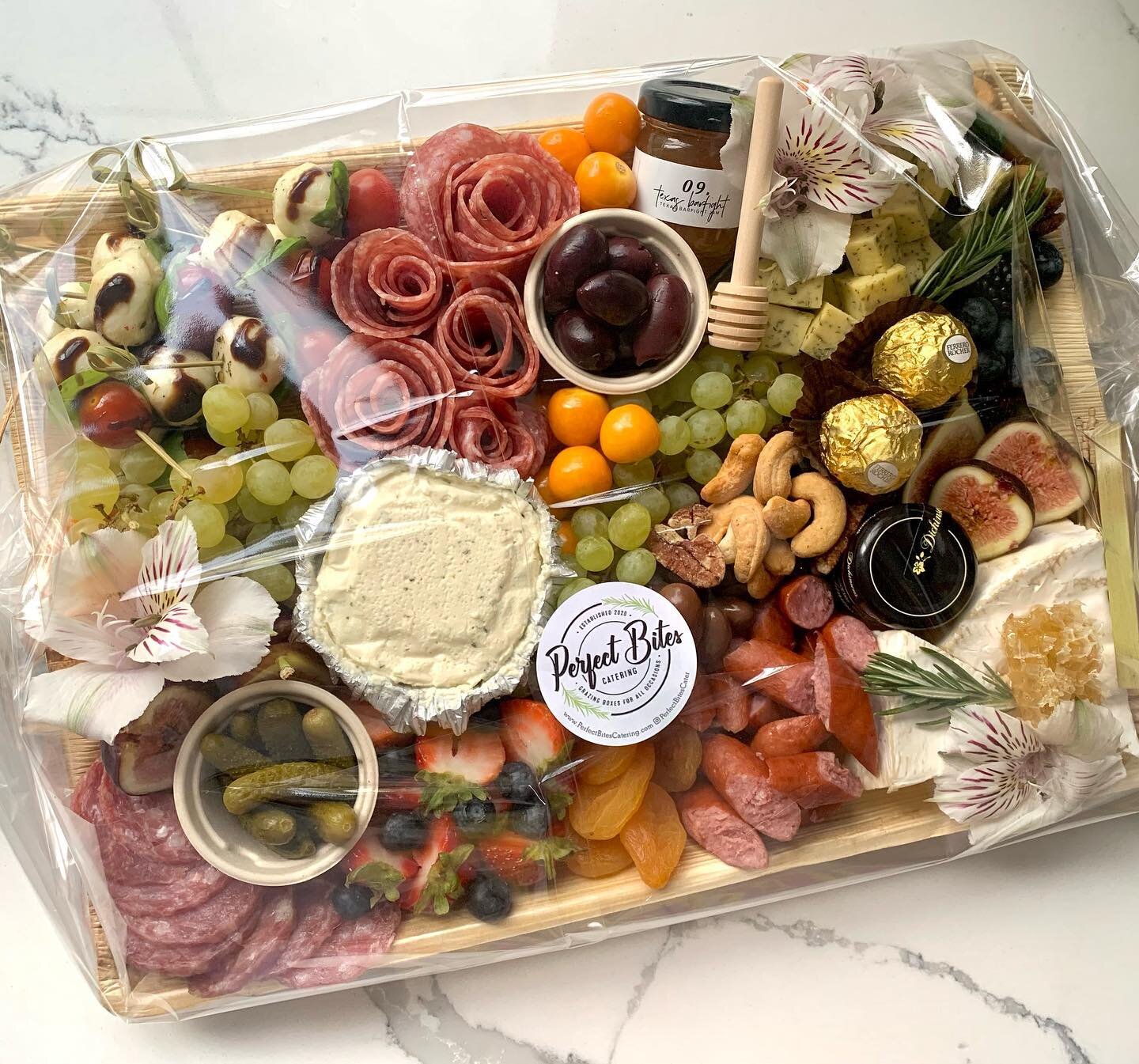 Created this board for our friends over at @shoppehoney 🤍 Support local, follow their account &amp; go shop this cute boutique😍
.
.
.
.
.
.
.
#PerfectBitesCater #charcuteriecups #charcuteriecones  #cheese #cheesebox #charcuterie #wedding #events #d