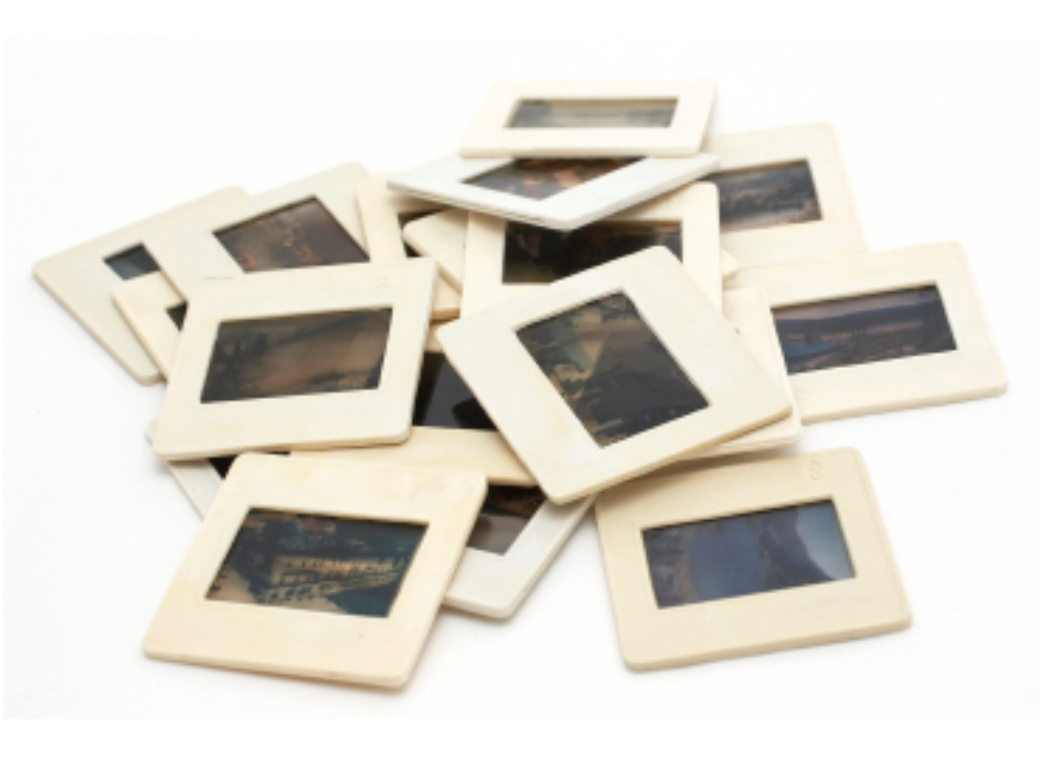 small stack of 35mm slides in white labels
