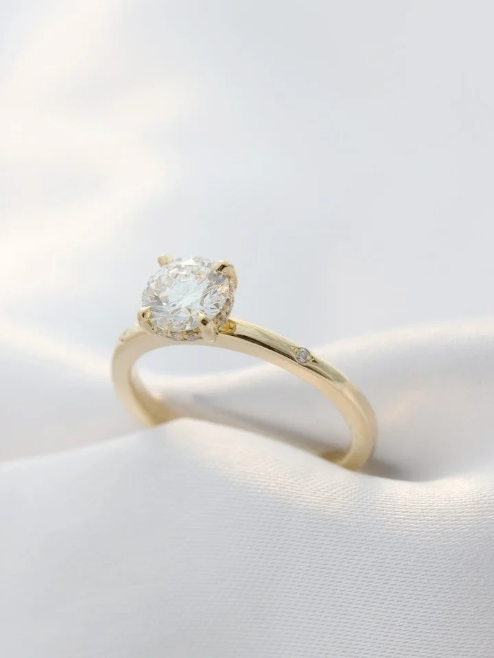 A piece made with love for dear friends 🤍 Crafted in 18ct yellow gold, featuring a hidden halo beneath the centre diamond and two star-set diamonds in the band &mdash; a timeless and elegant design with a personal touch ✨

#ThomasCoenJewellery #Firs