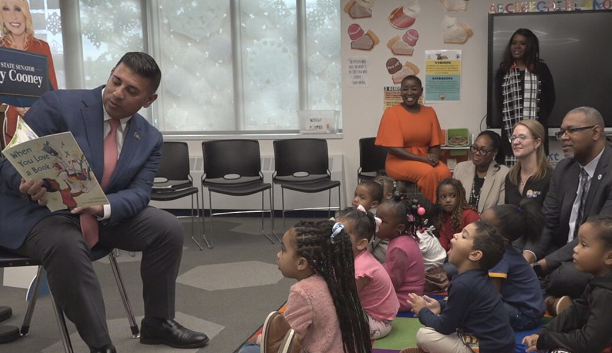 Senator Jeremy Cooney reading to children at 100,000 book celebration