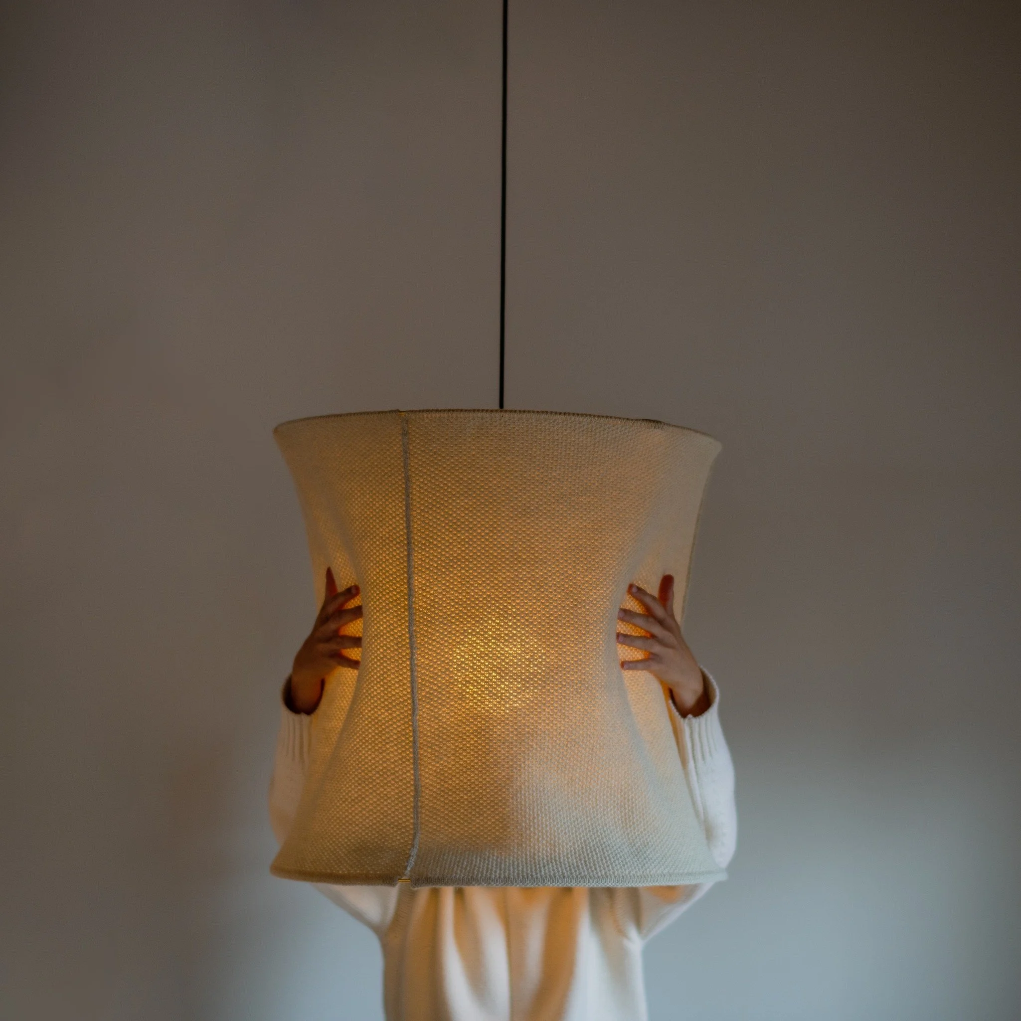 Give me a (warm) hug.

Wool has a way of holding light differently &mdash; soft, warm, and deeply comforting.
The Wool Hoop&rsquo;s knitted honeycomb structure filters light through layers of natural fibre, creating a gentle glow that brings a sense 