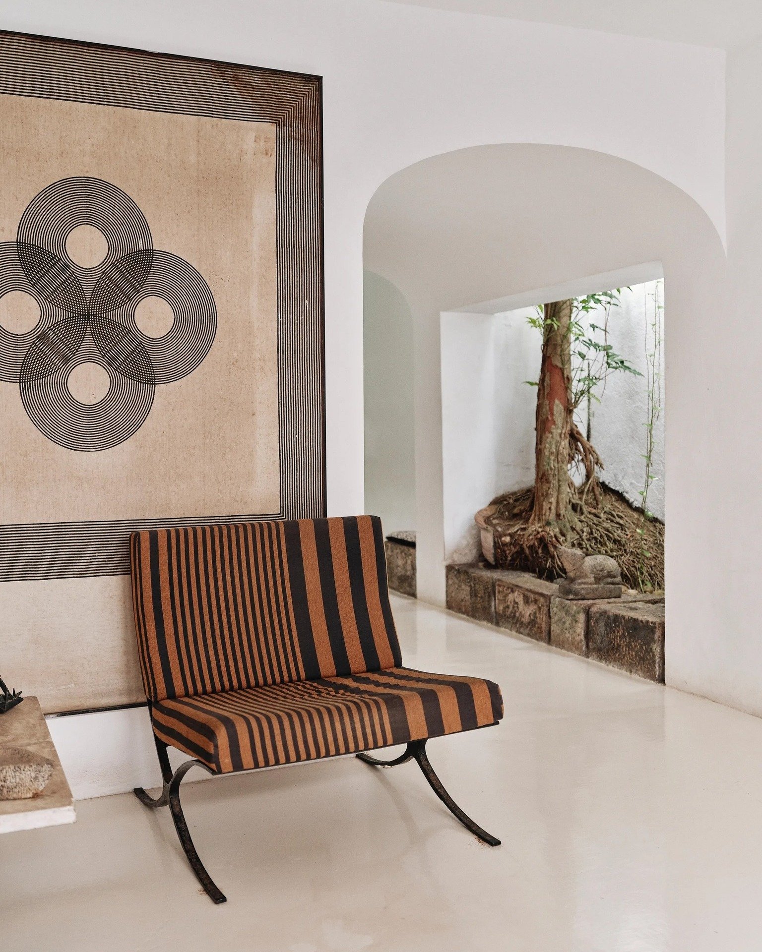 What could be more genuine than working with the materials we grow ourselves, alongside craftspeople from our own land?

This is Geoffrey Bawa&rsquo;s Sri Lankan re-imagining of Mies van der Rohe&rsquo;s iconic Barcelona chair, made in the 1960s when