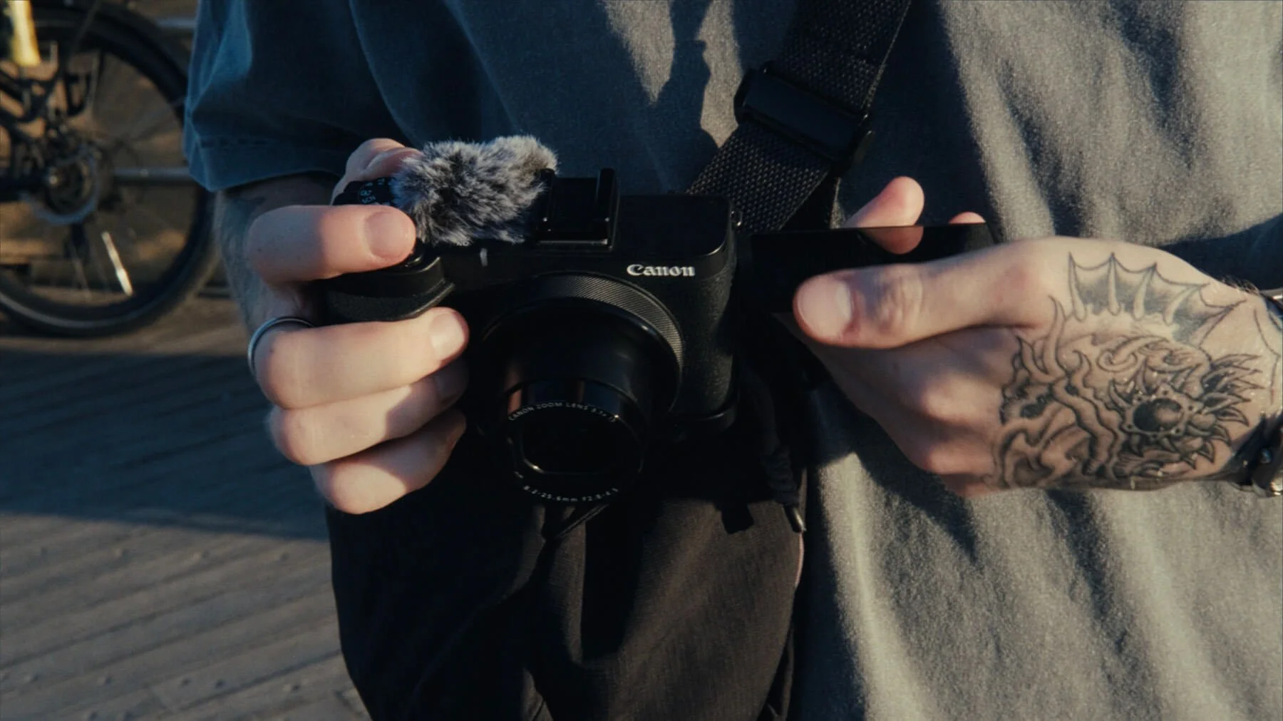closeup of the canon powershot v1 in a persons hands