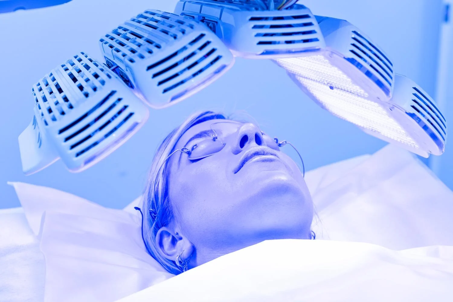 Woman receiving LED Healite therapy treatment at Gold Coast Dermatology Clinic.