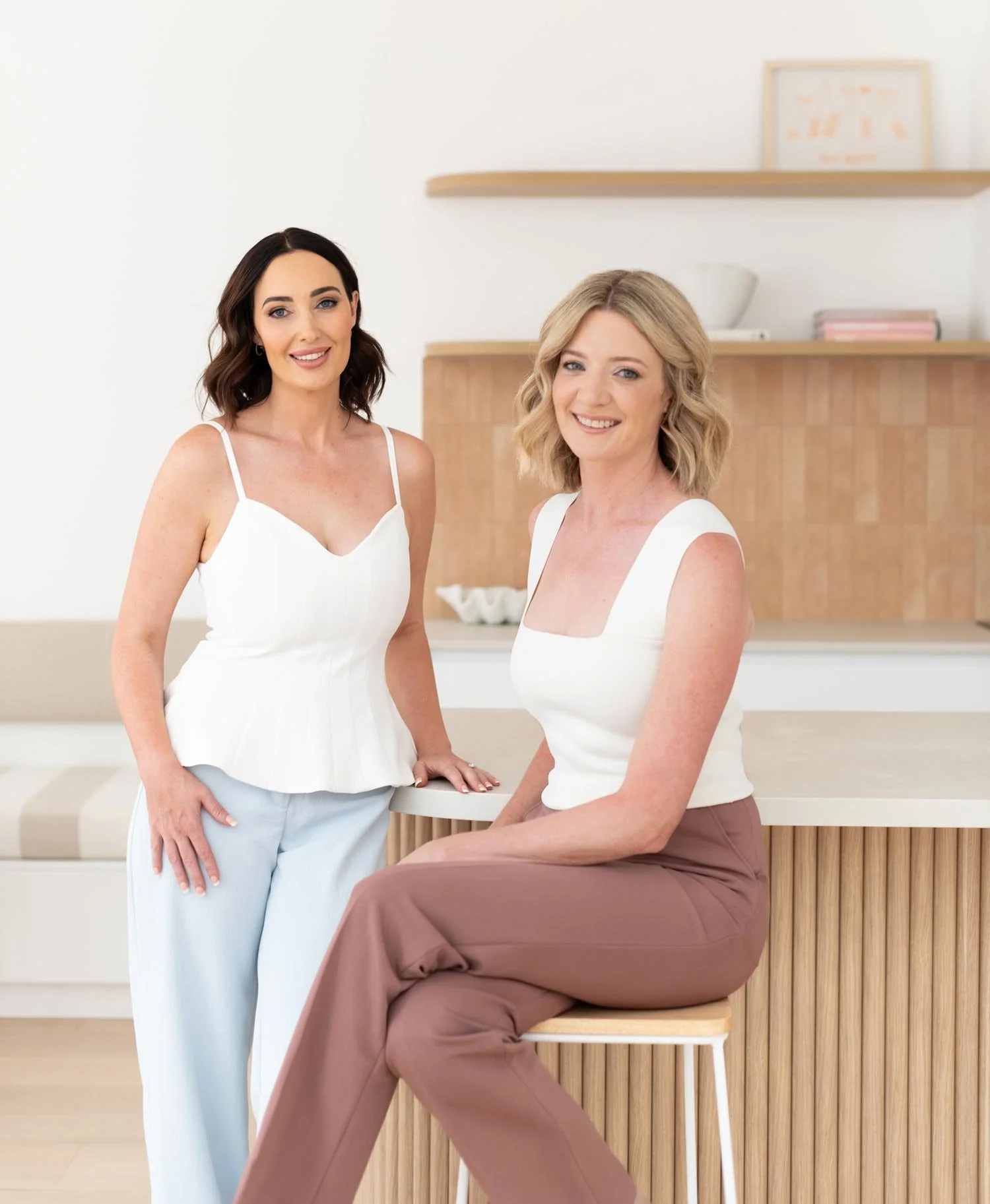 Dr Samantha Davidson with short blonde hair seated, with Tahlia practice manager.