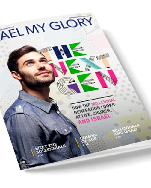 Close-up of a magazine cover titled 'Revealing My Glory.' The cover features a young man with dark hair and a beard, wearing a denim shirt, looking upward. The magazine discusses how the millennial generation views life, church, and Israel, with subtitles about meeting millennials and the upcoming age of millennials and Israel.