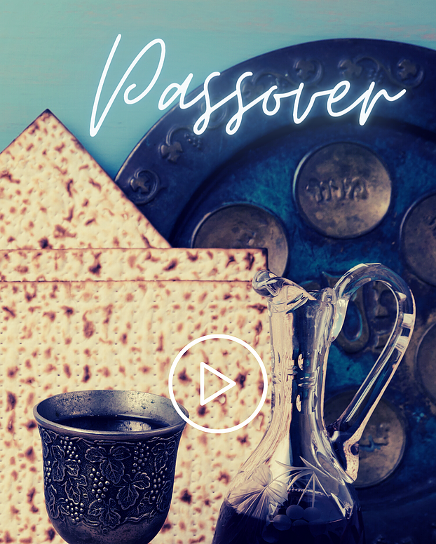 A Passover Seder setting with matzah, a decorative cup, a glass wine decanter, and a plate with the word 'Passover' written above.