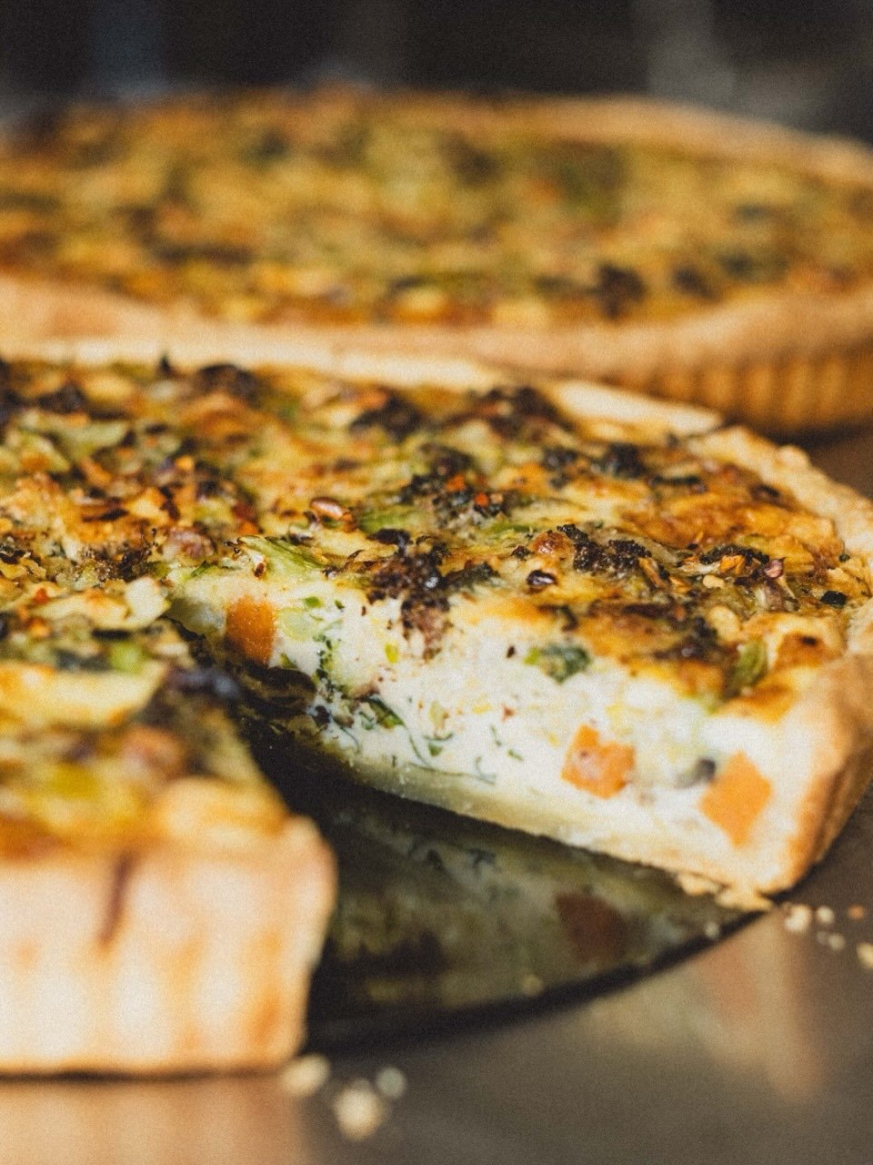 Veggie tart in final form - our homemade sour cream pastry filled with seasoned roasted veggies, eggs, cream + cheese. Enjoy with some fries or grilled greens and homemade tomato chutney or chilli jam 🥦🥔🥕

#homemade #cafe #basscoast #visitvictoria