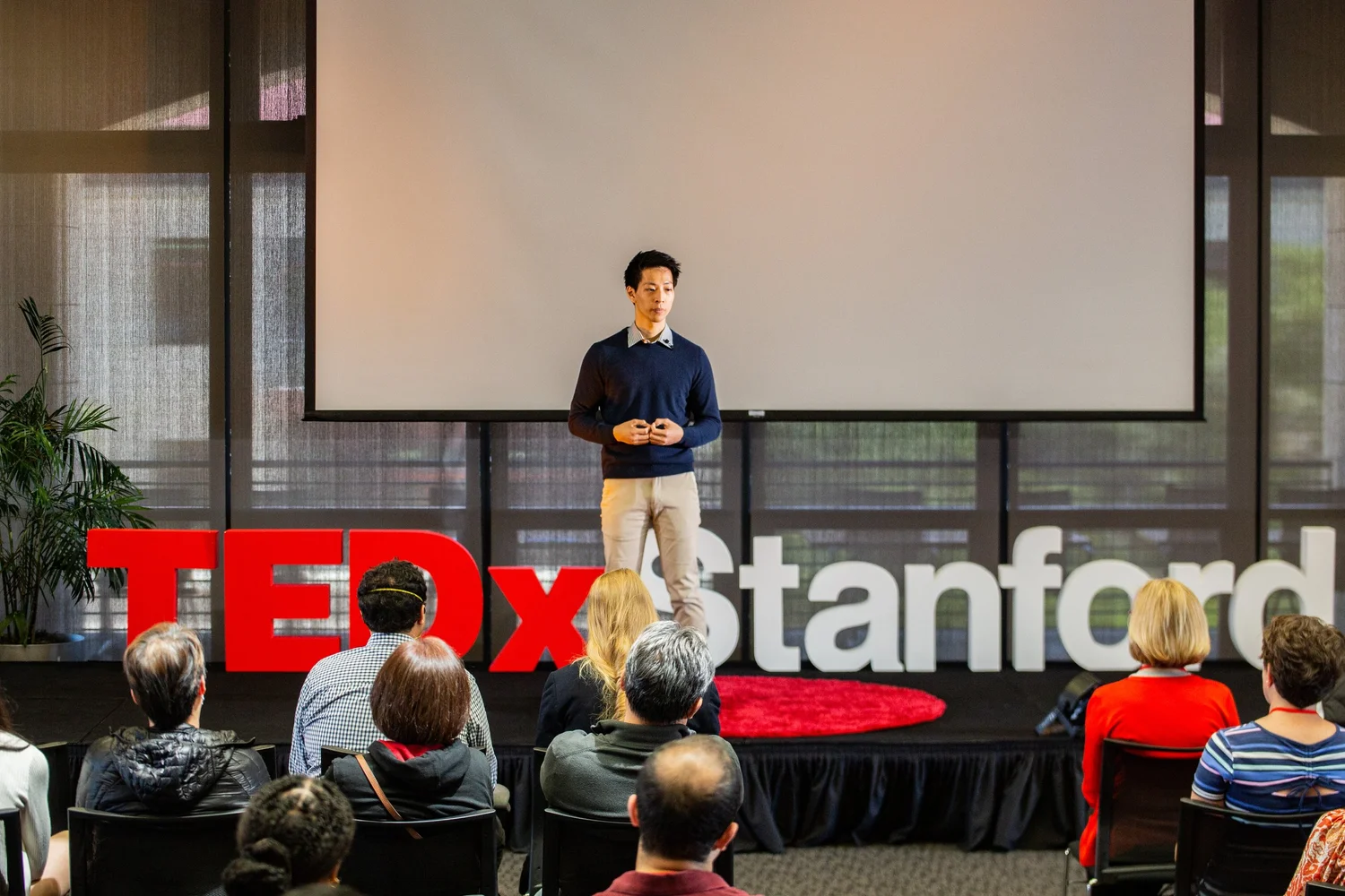 Henry Bair speaking on the TEDxStanford stage