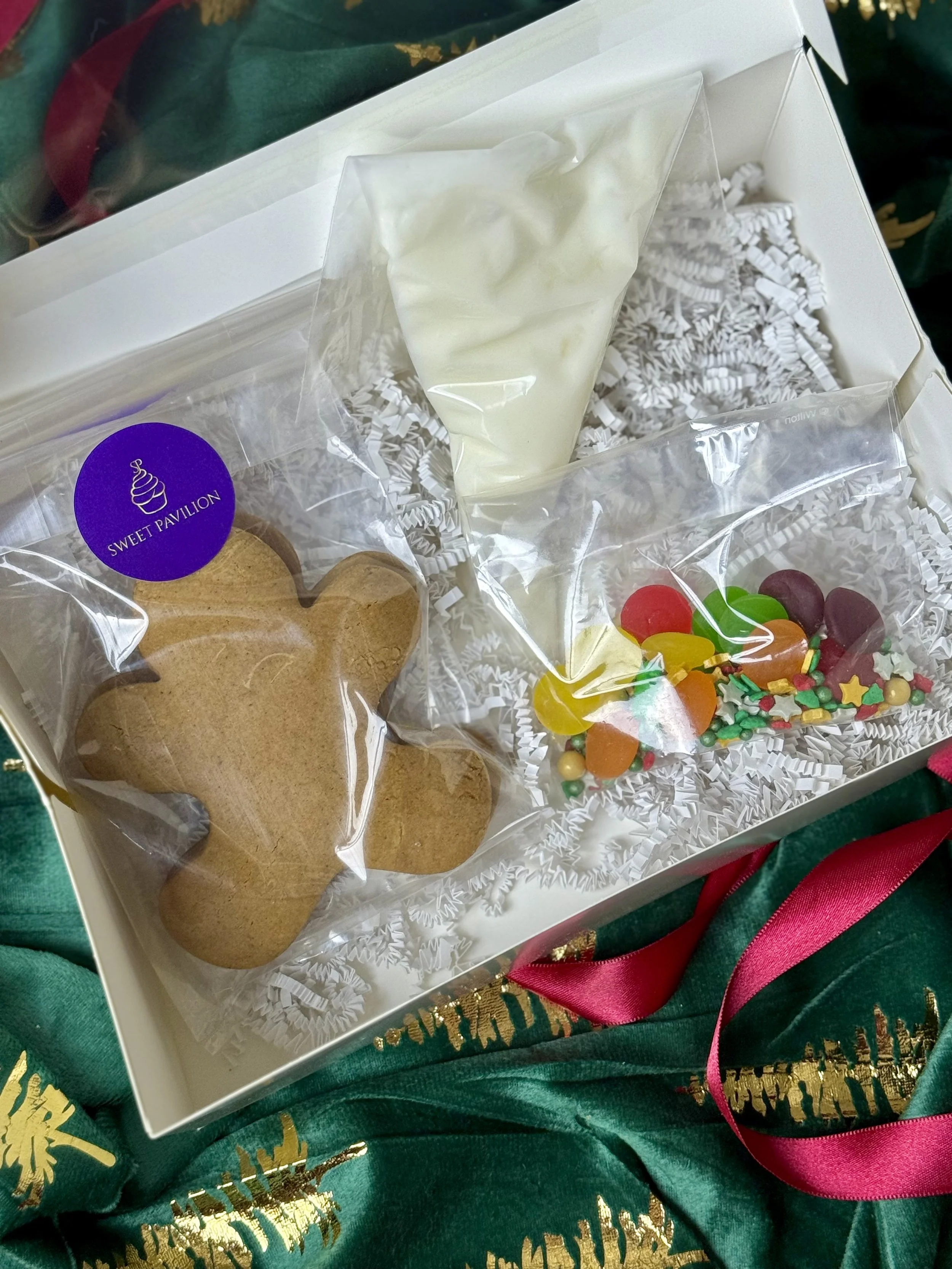 Gingerbread decorating kit, christmas gingerbread man, charlotte activities for moms and kids, indian trail nc bakery, white cookie icing set, fun activities for kids near me, designer cookie kit