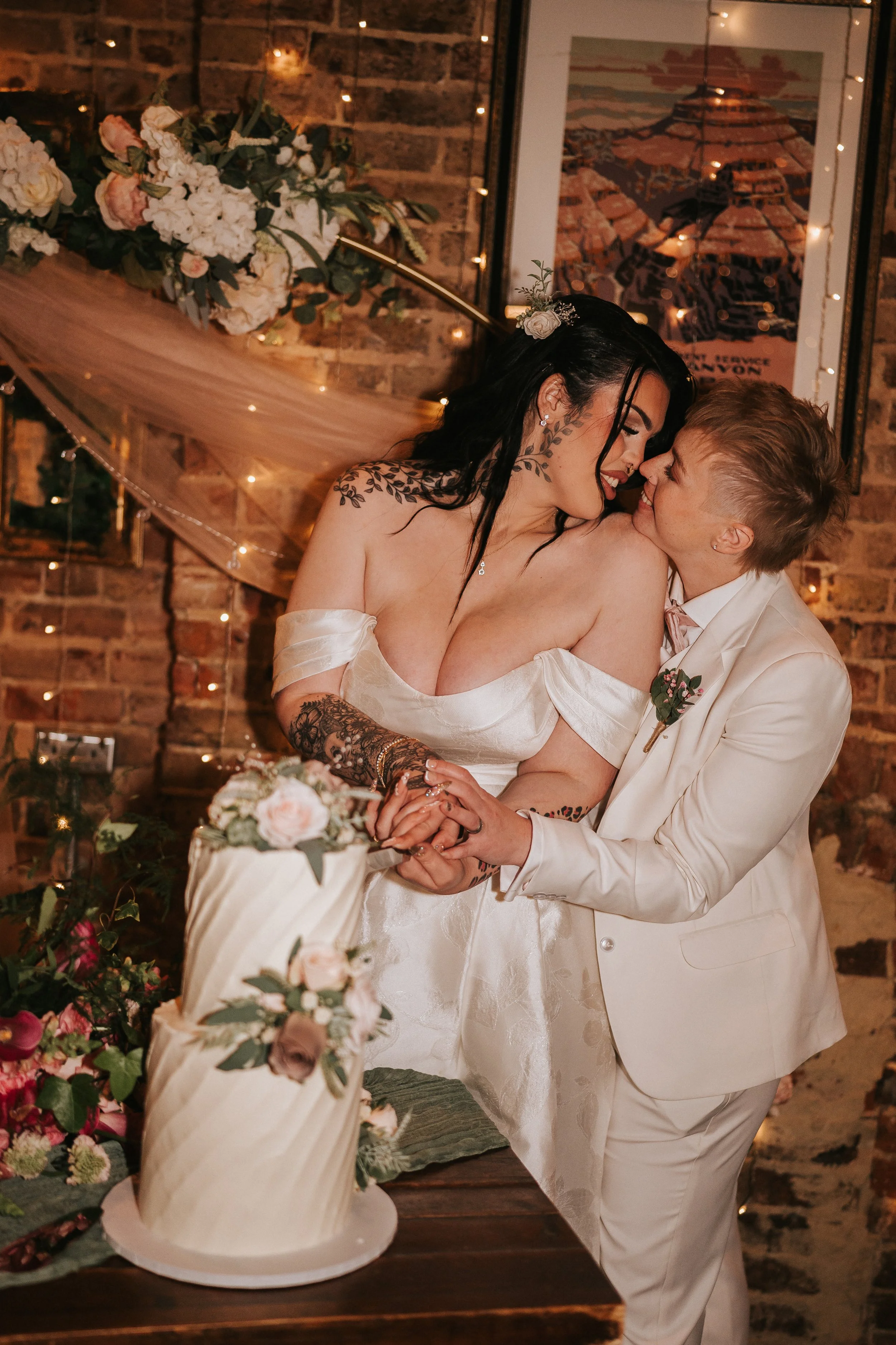 LGBTQ+ Couple cutting their wedding cake, in Brighton
