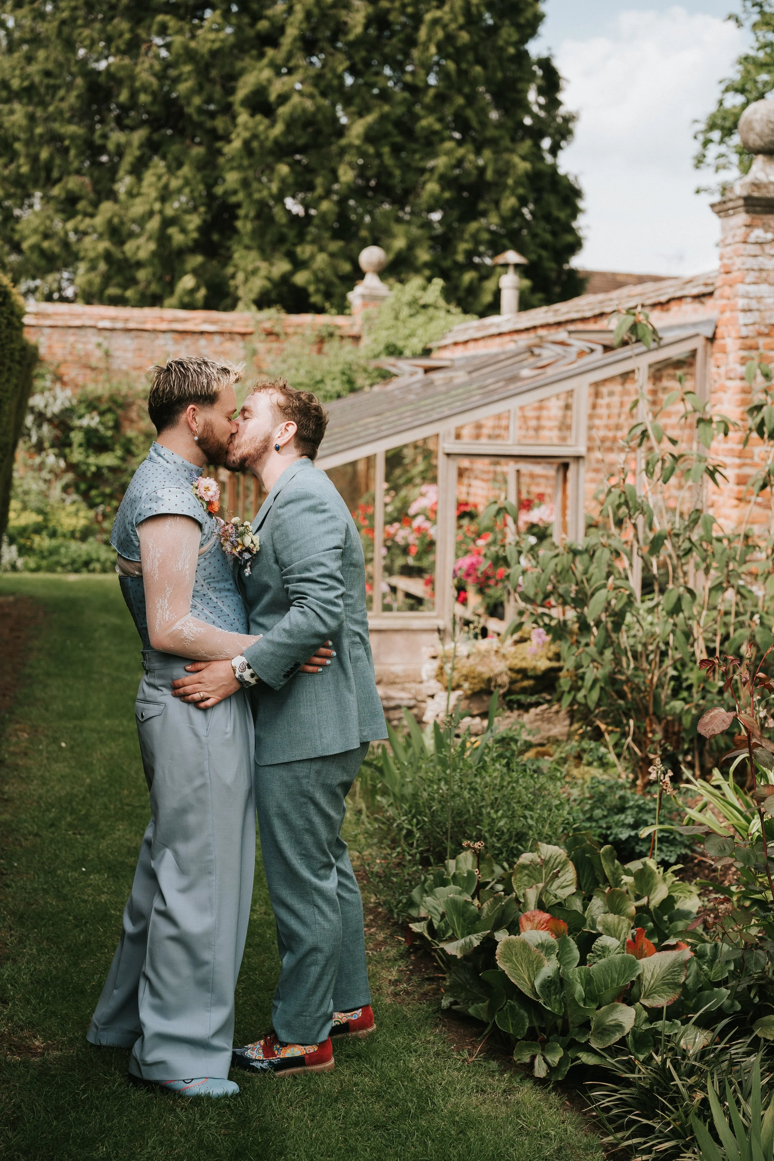 Two men kissing on their wedding day