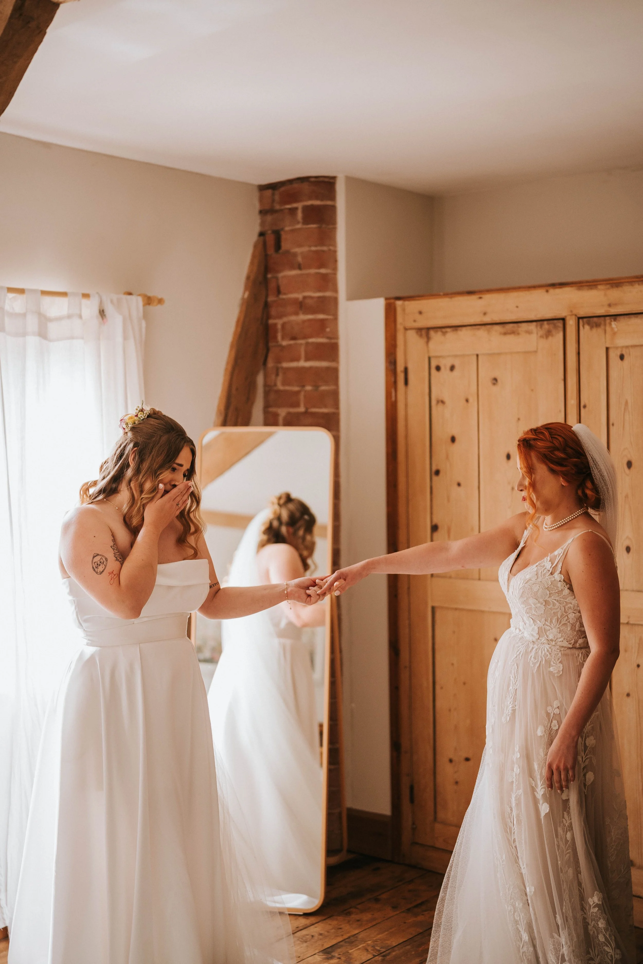 Two Brides doing their first look before they walk down the aisle