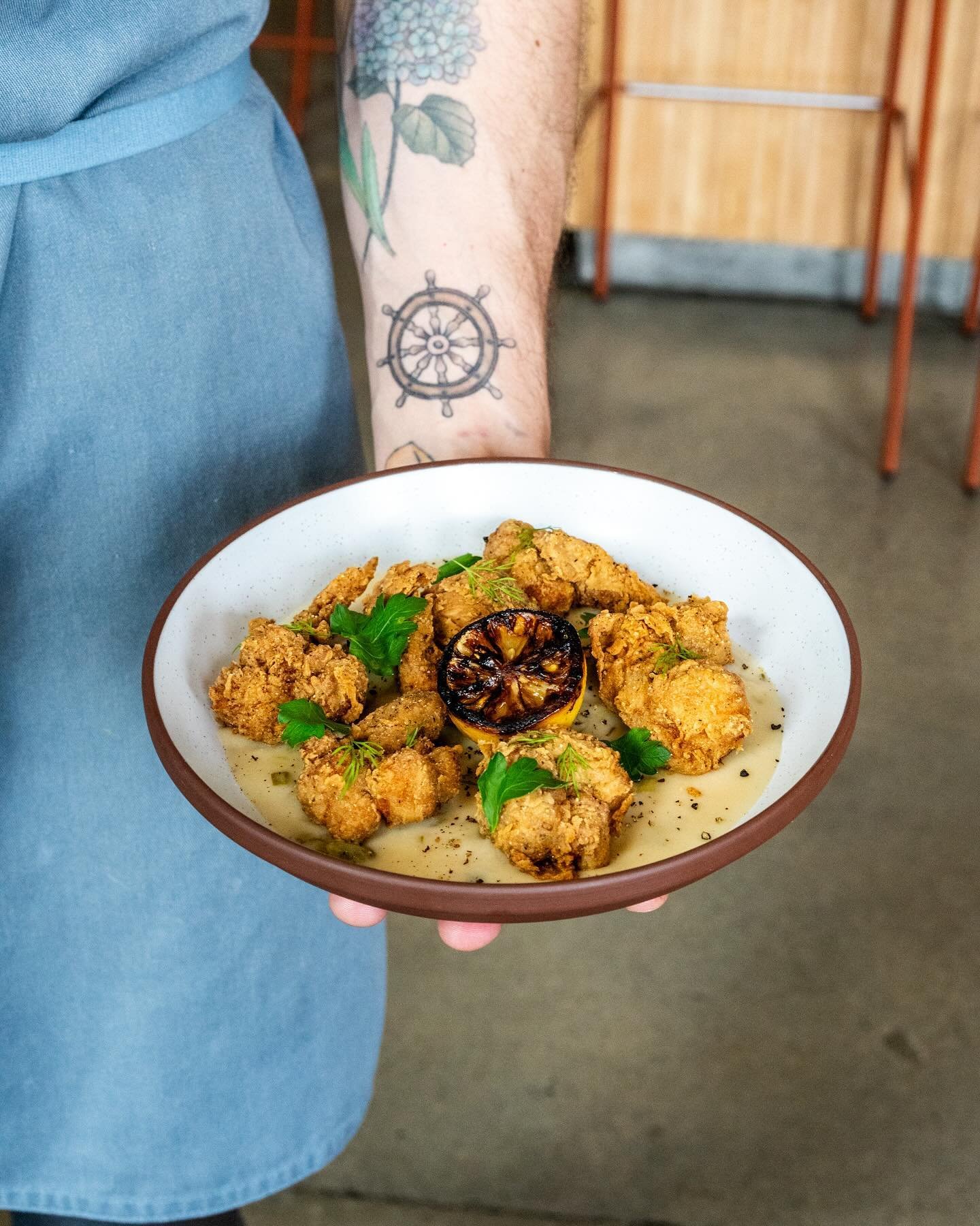 🚨 New menu item alert! 🚨
&zwnj;
Pictured here are our masa fried mushrooms, an homage to Chefs roots and our farmer partners spring bounty. The mushrooms are deep fried and sit on a bed of gravy made with green garlic, topped with fresh herbs and c