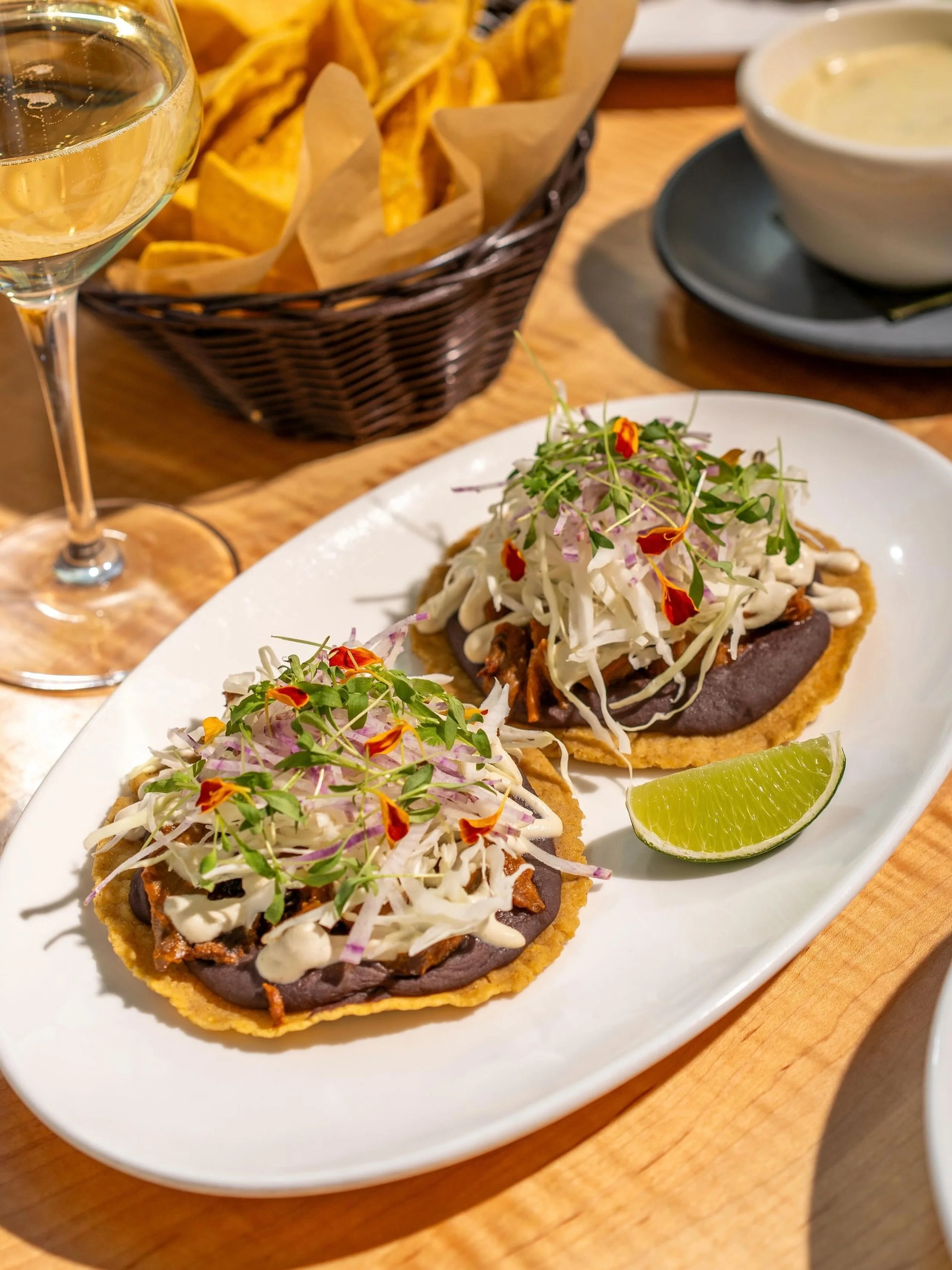 Tinga tostadas are back... with a summer glow up! Smoky mushroom tinga, crunchy slaw, and a new twist: @pearsonfarmga peaches simmered into the sauce for a little sweetness in every bite.

Same crispy tostada. Same messy-first-bite energy. New obsess