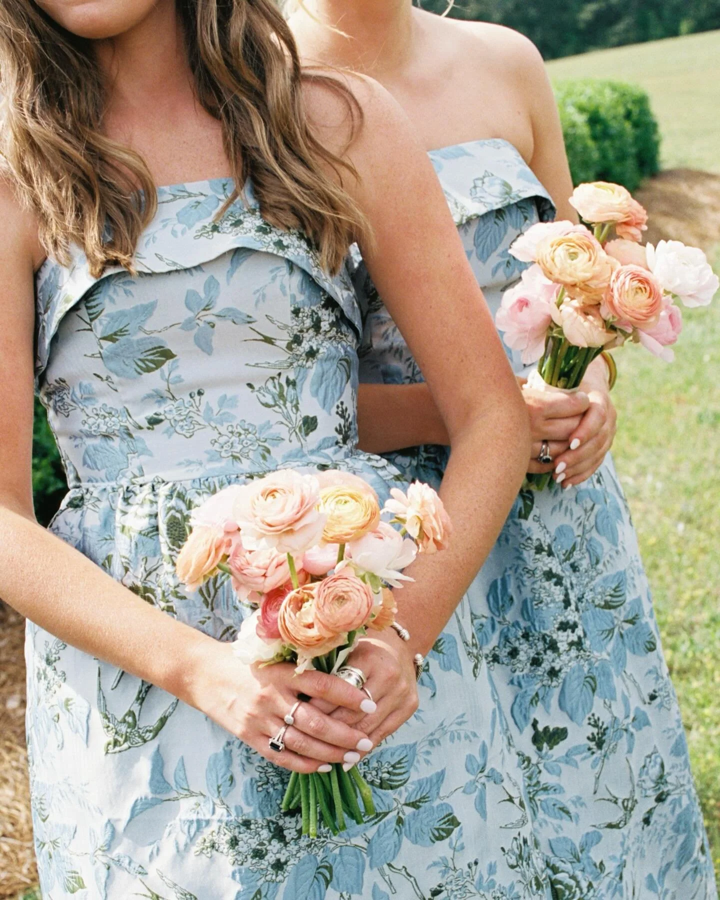 Libby &amp; her bridesmaids were the true definition of spring wedding magic!! ✨ from the romantic blue floral dresses, to the peachy-pink ranunculus bouquets &mdash;they were the perfect touch to bring Libby&rsquo;s colorful spring, garden party vis