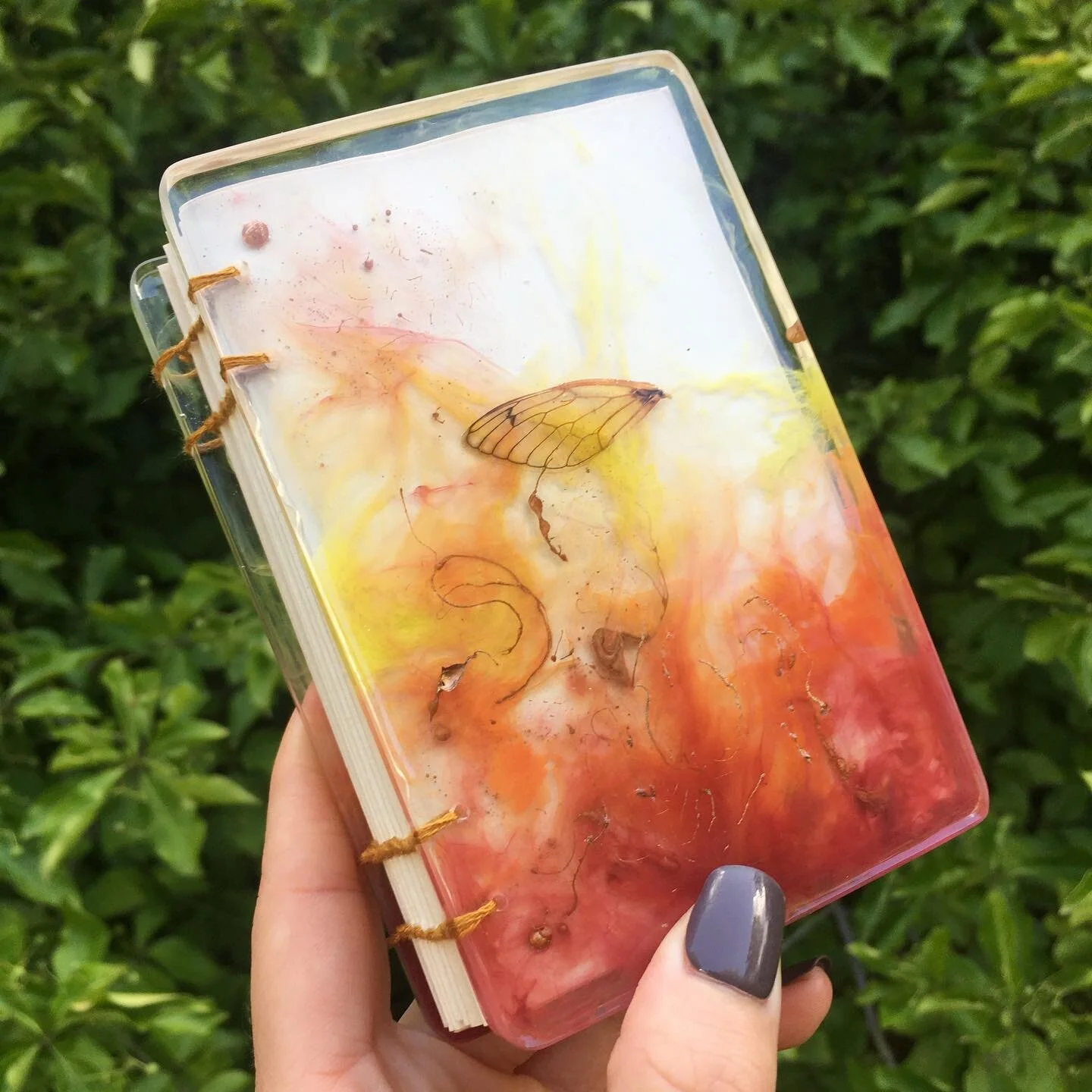 SOLD. Flaming Cicada. Im so proud of this book and excited to be experimenting everyday! I mean LOOK🔥 AT 🔥 HER 🔥. I made a flame in a book say whatttttttt?!?! 
.
.
.
.
.
.
.
.
.
#artistsoninstagram #localbusiness #localartist #resinart #epoxyresin