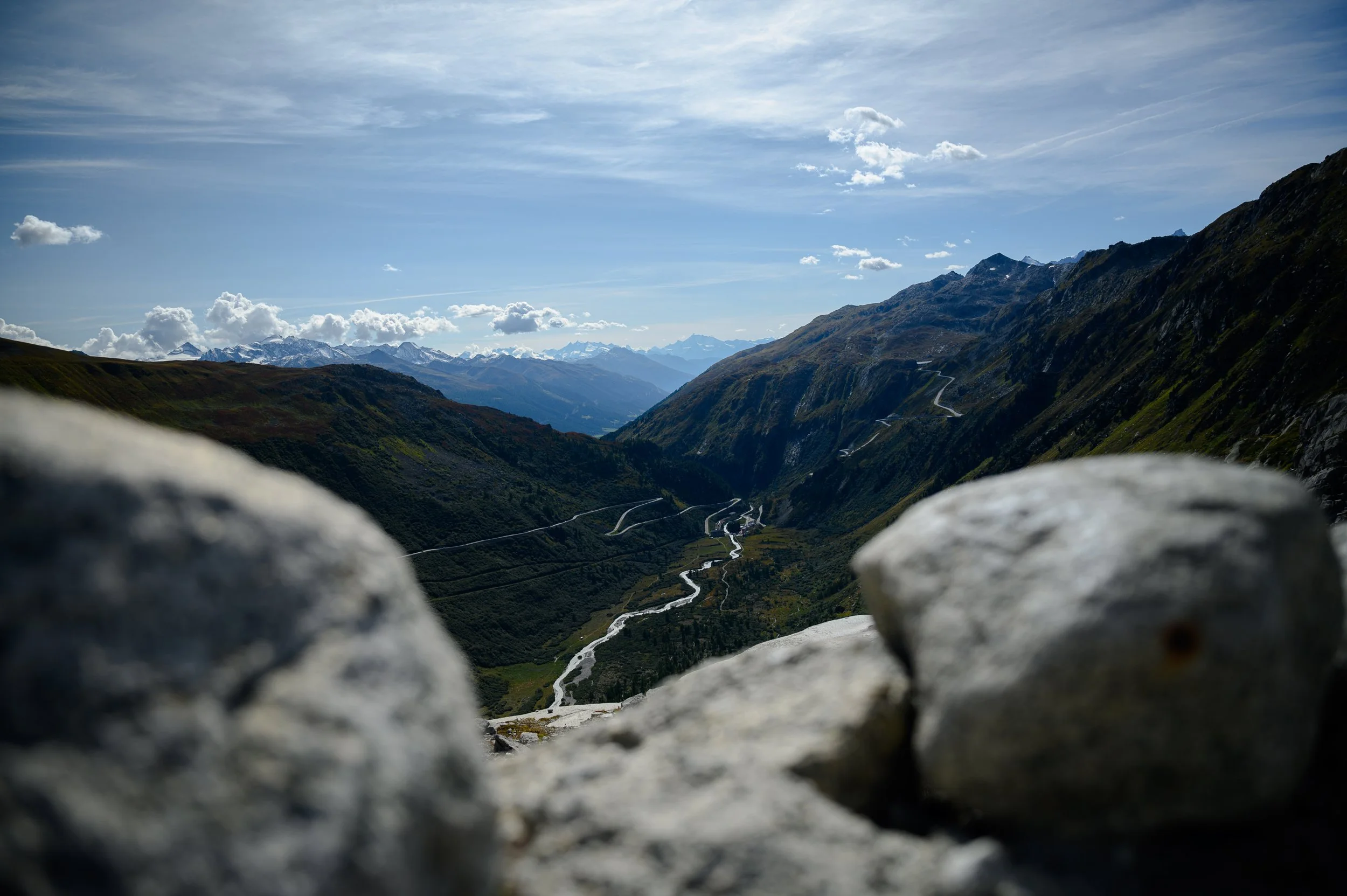 View between two rocks down the valley towards Gletsch, the Rhône and the Furka Pass road