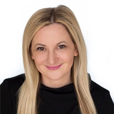 Image of Lucy Tournas in a black top.