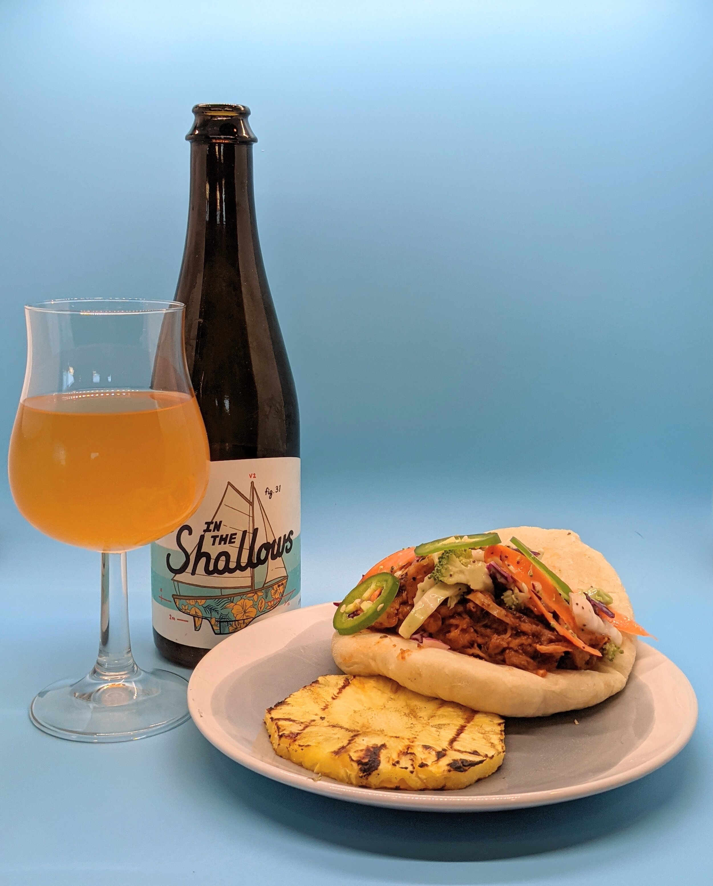 "Refreshing Rum-Inspired Sour Ale and Flavorful Bao Bun BBQ Jackfruit Sandwich"