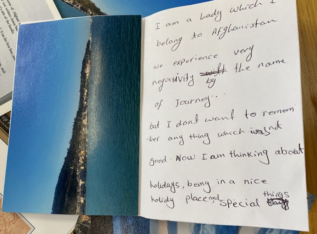 A zine page describing a migrant journey from Afghanistan, with a photo of the sea