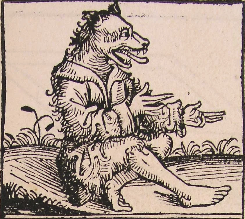 Woodcut of a man with a dog head