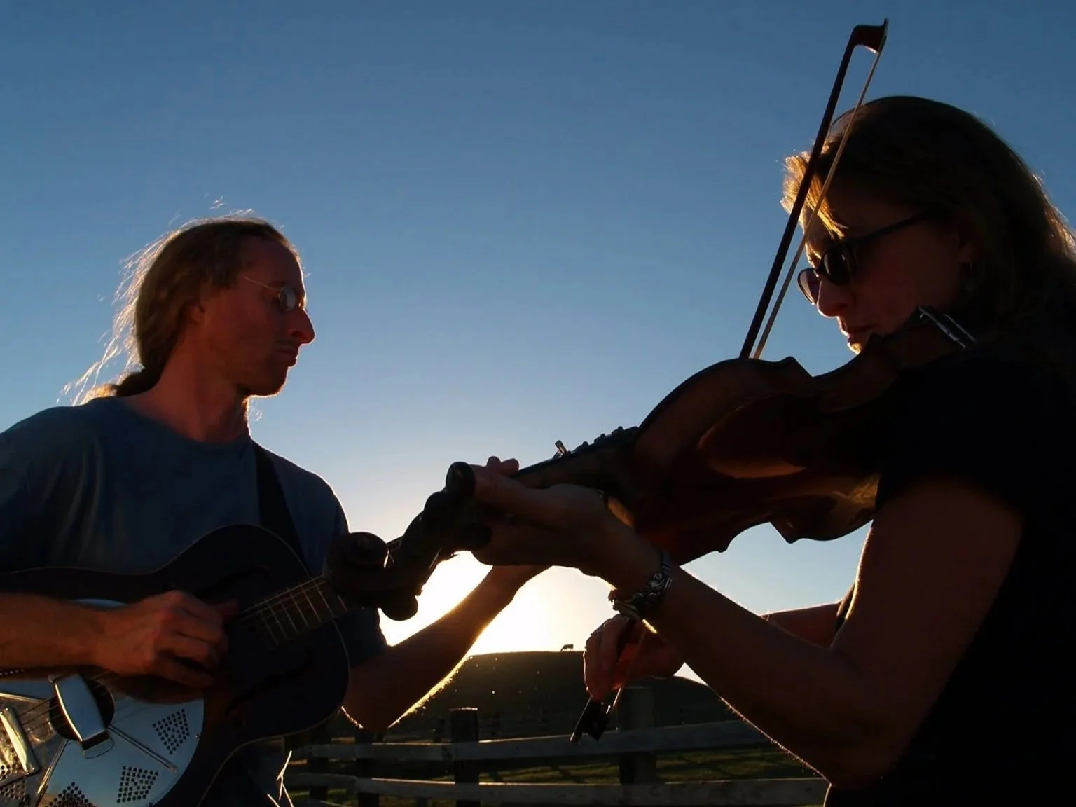Image of Frogwater members,, Susan and Jack Nicholson playing instruments.