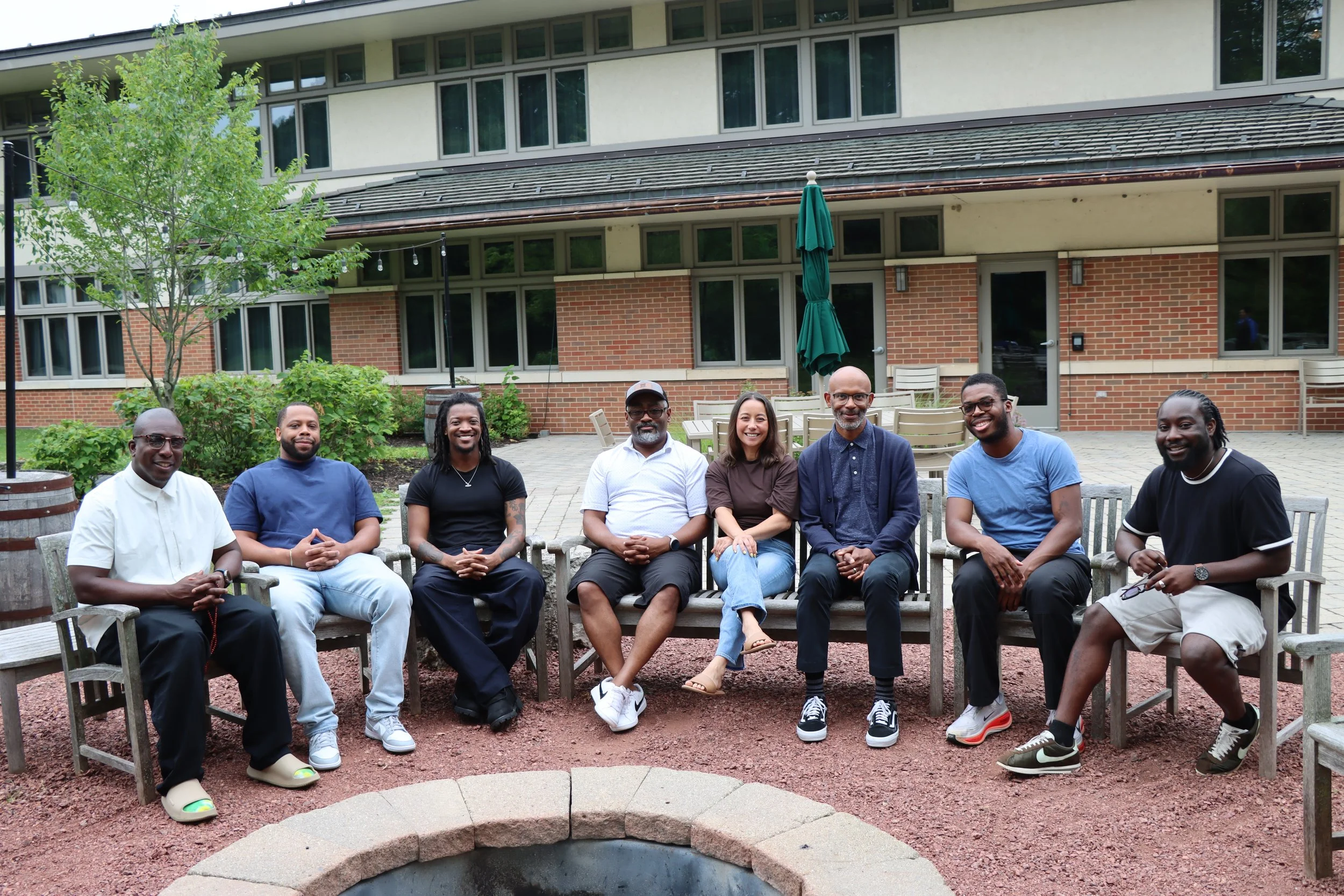 Photo of participants of Black Boy and Digital Futures Book Jam sitting around a bonfire.