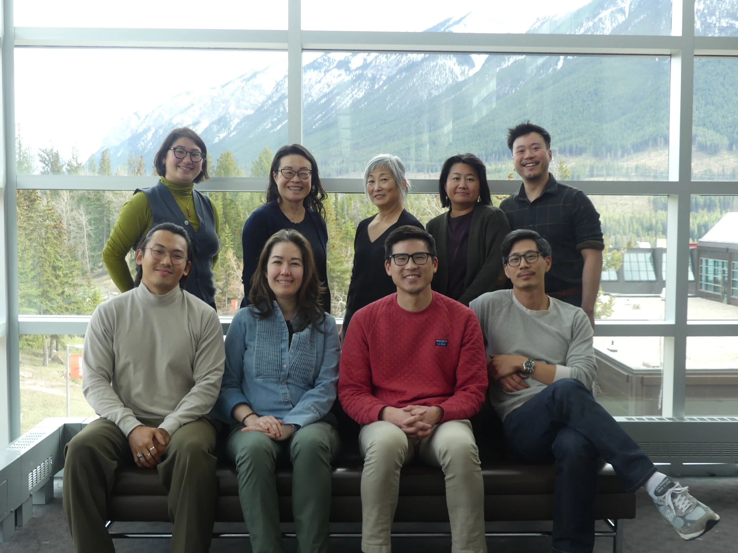 Posed photo of Brian J. Chen, Julie Chu, Jasmine Ehrhardt, Tara Fickle, Huan He, Grace Hong, Paul Kim, Lisa Nakamura, & K. Ian Shin