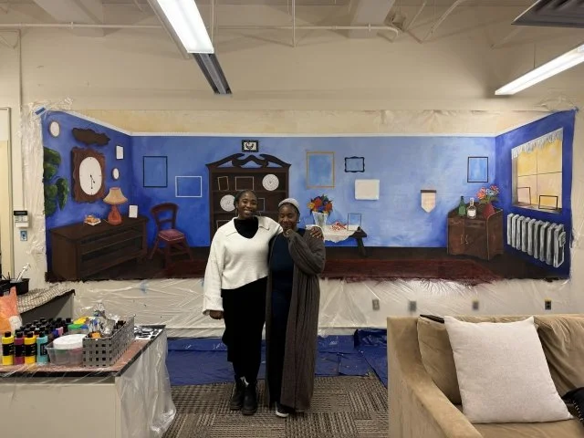 Rianna and Maïa Walcott in front of BCaT Lab Black Homeplaces Mural