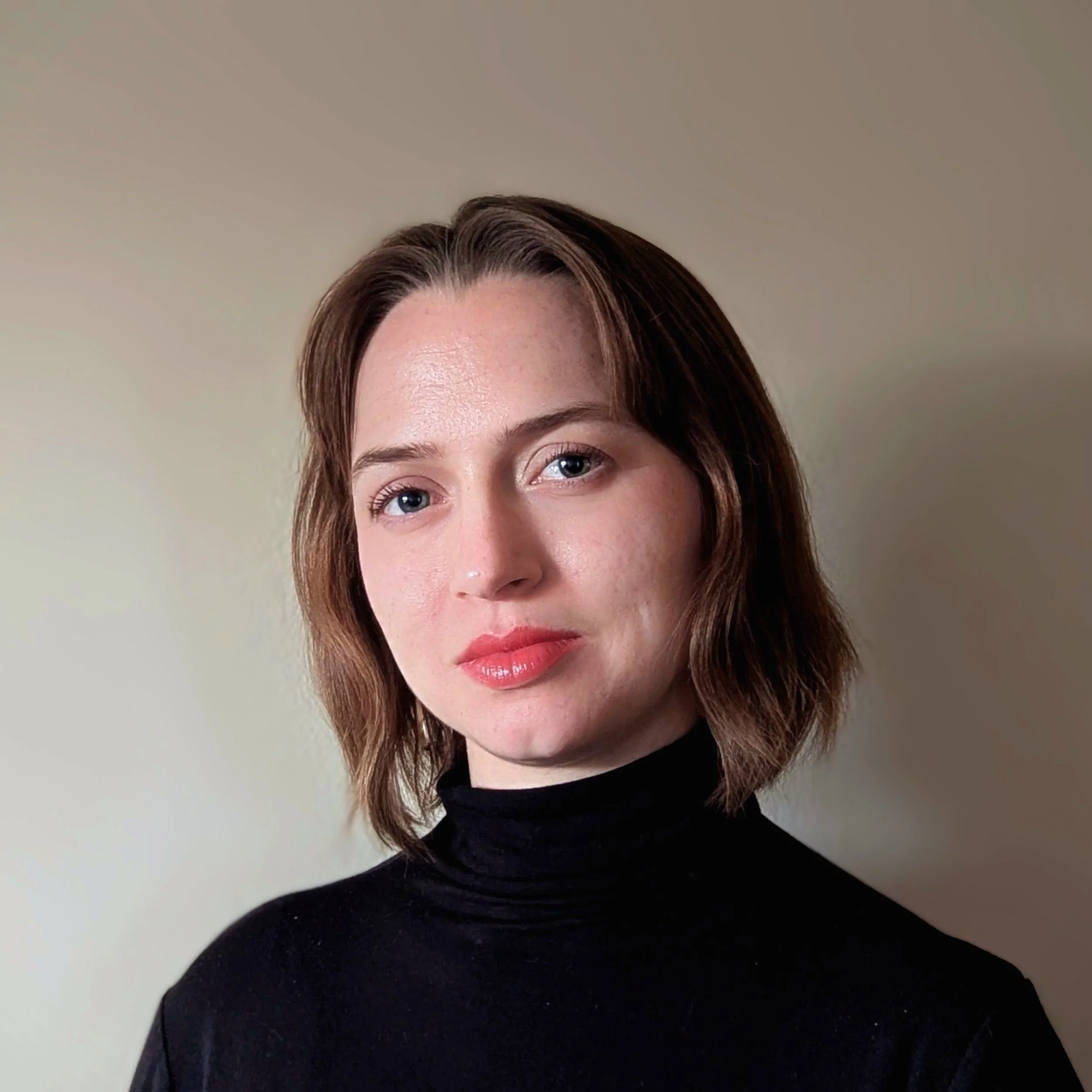 Photo of Natalie Leonare, a white individual with short hair 