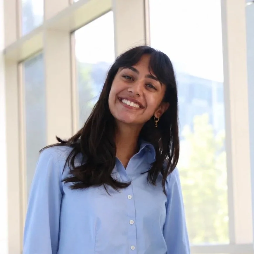 Photo of Misri Modi, a South Asian woman smiling at the camera.