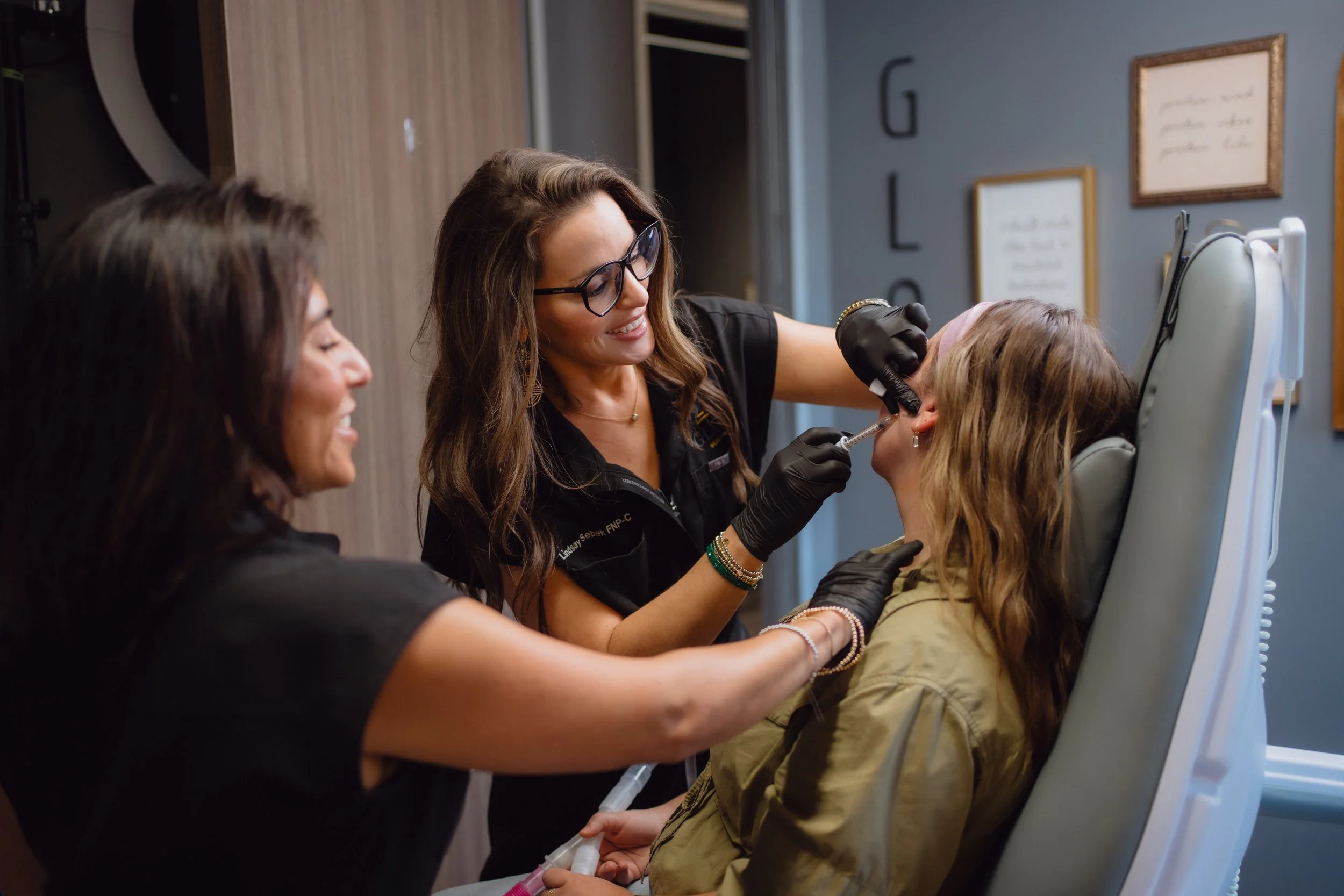 Lindsay Sebek, FNP-C injecting lip filler for a patient at Glow Skin Lab in San Antonio
