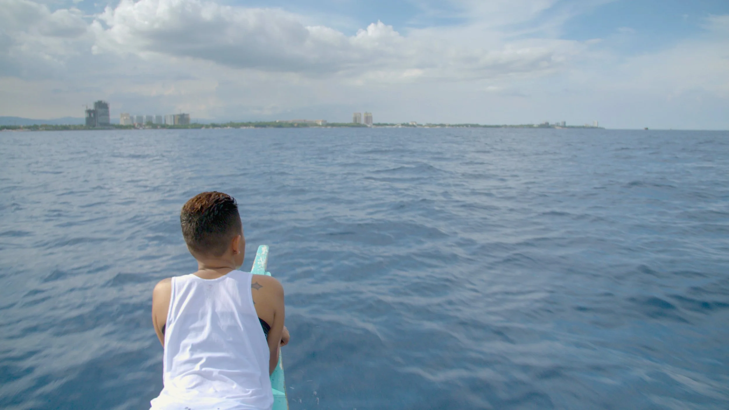 Sara out front on a banca boat