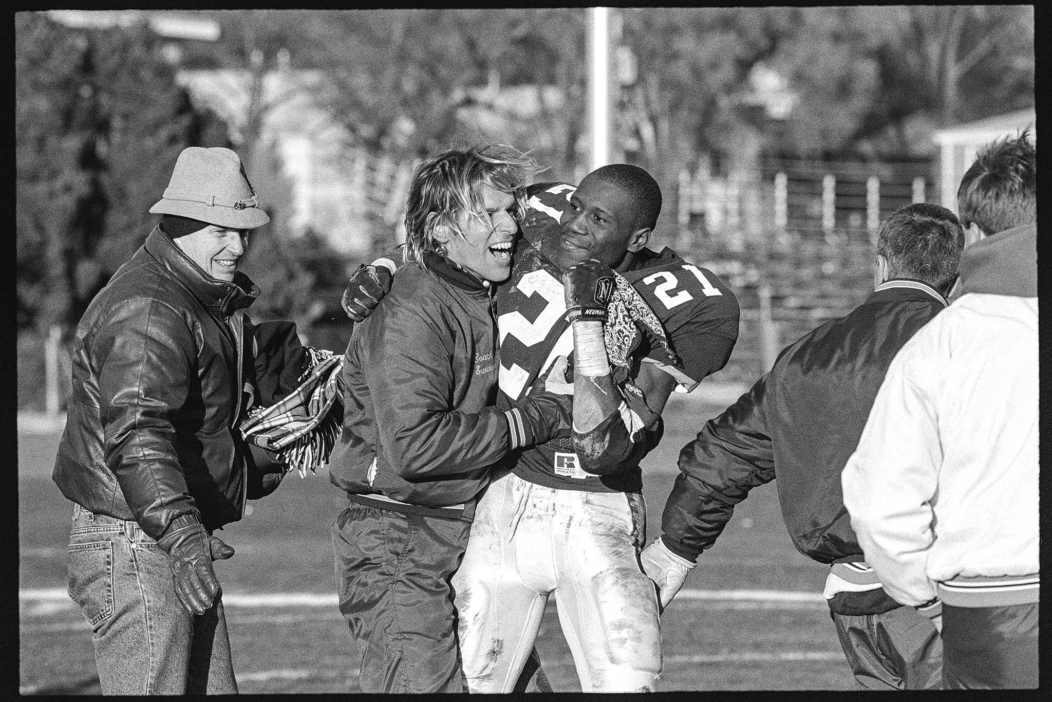 Associate Head Coach Mike Swider '77 and Nakia Jordan '97 celebrate Wheaton's first victory over Augustana since 1978, November 4, 1995