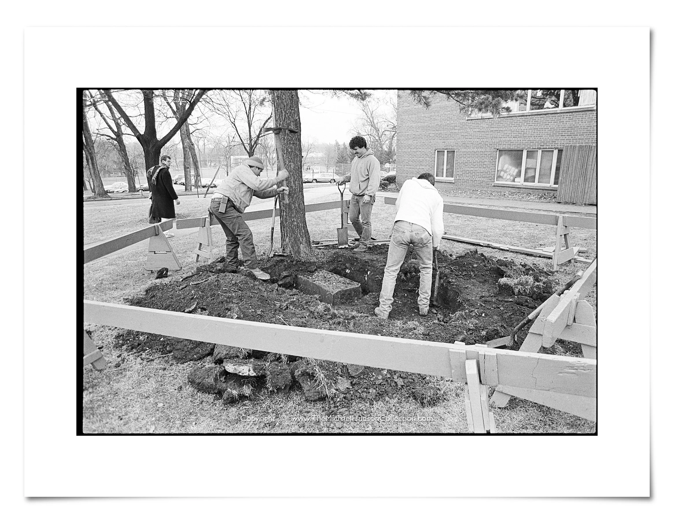 Digging up the buried gravestone of abolitionist James E. Burr (1814-59) next to Williston Dorm, December 15, 1986