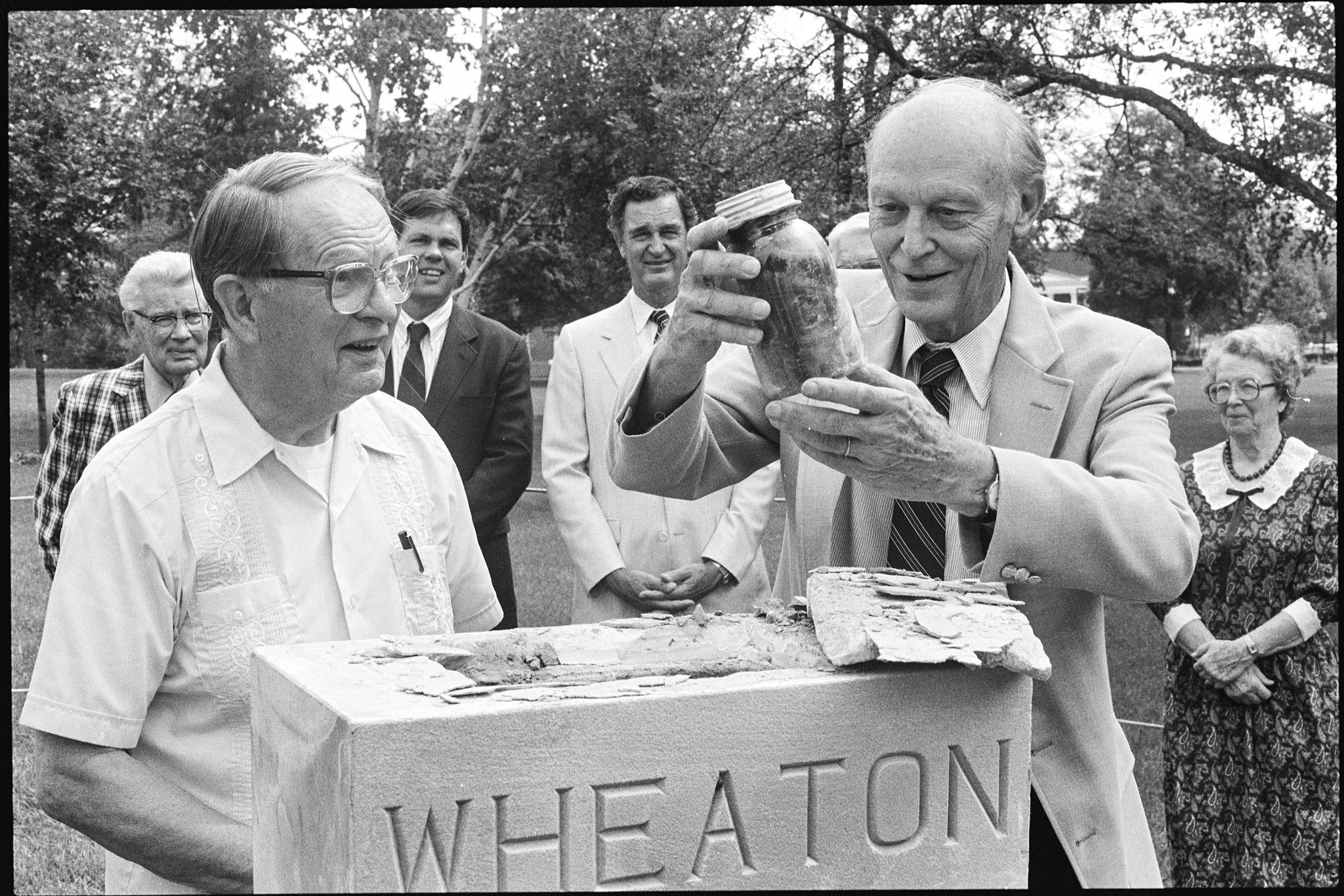 Class of 1938 time capsule being opened by Ken Taylor '38 and Howard Fischer '38, (it needed to be moved to make way for widening the entrance to campus), September 8, 1989