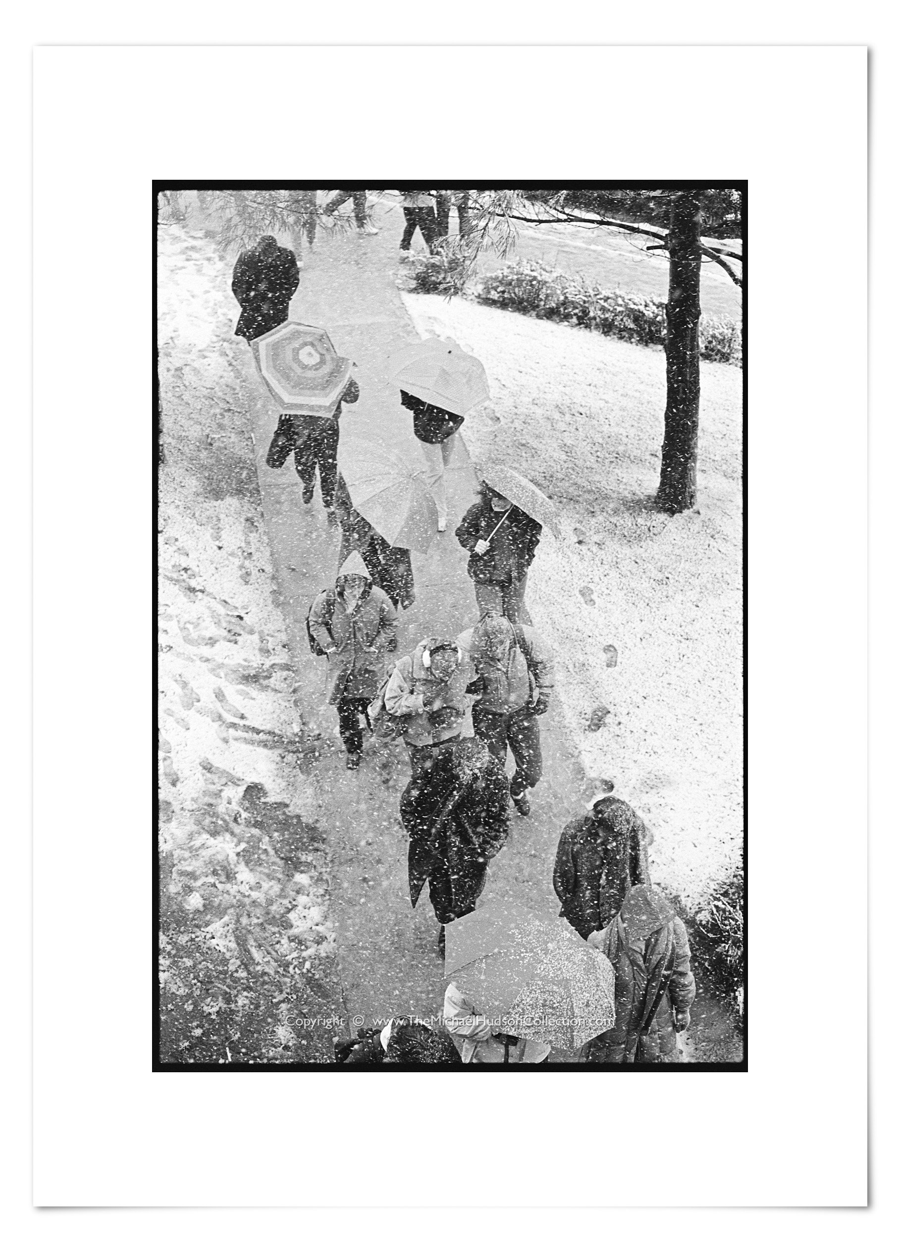 Students walking in snowstorm, November 18, 1986