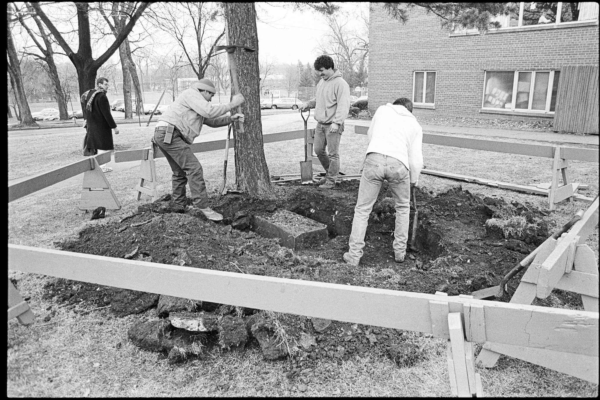 Digging up the buried gravestone of abolitionist James E. Burr (1814-59), December 15, 1986