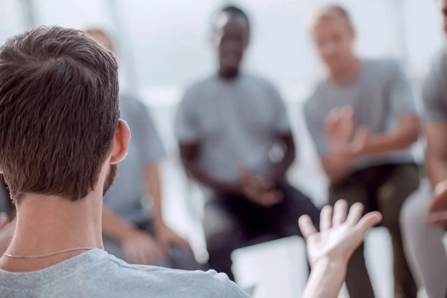 "Practitioner and client in family violence counselling session"